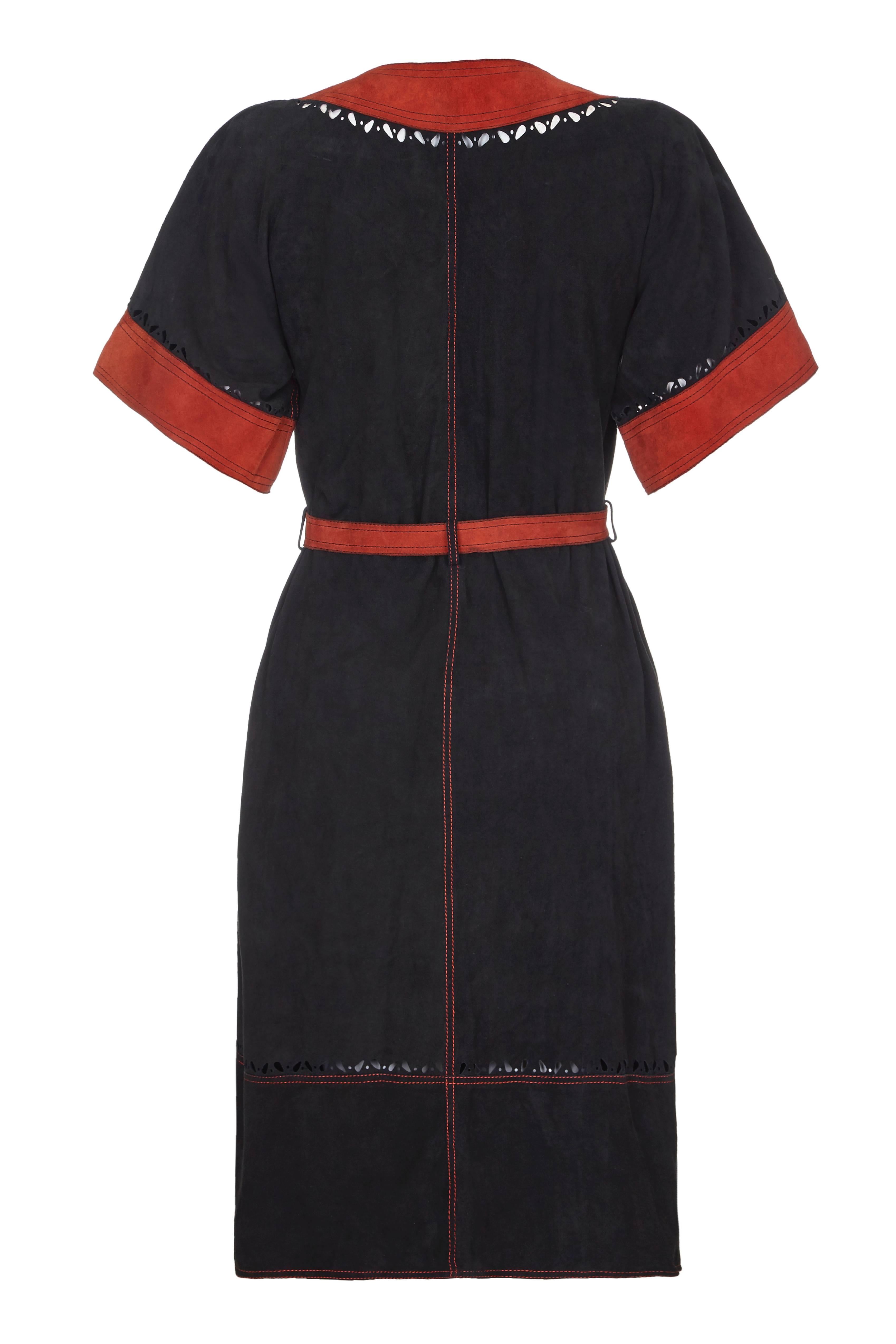 Amazing vintage 1970s Jean Muir black suede dress with terracotta suede details including belt, edging and applique leaves.  This fantastic winter piece fastens at the front with buttons and also features small cut out details and top-stitching. 