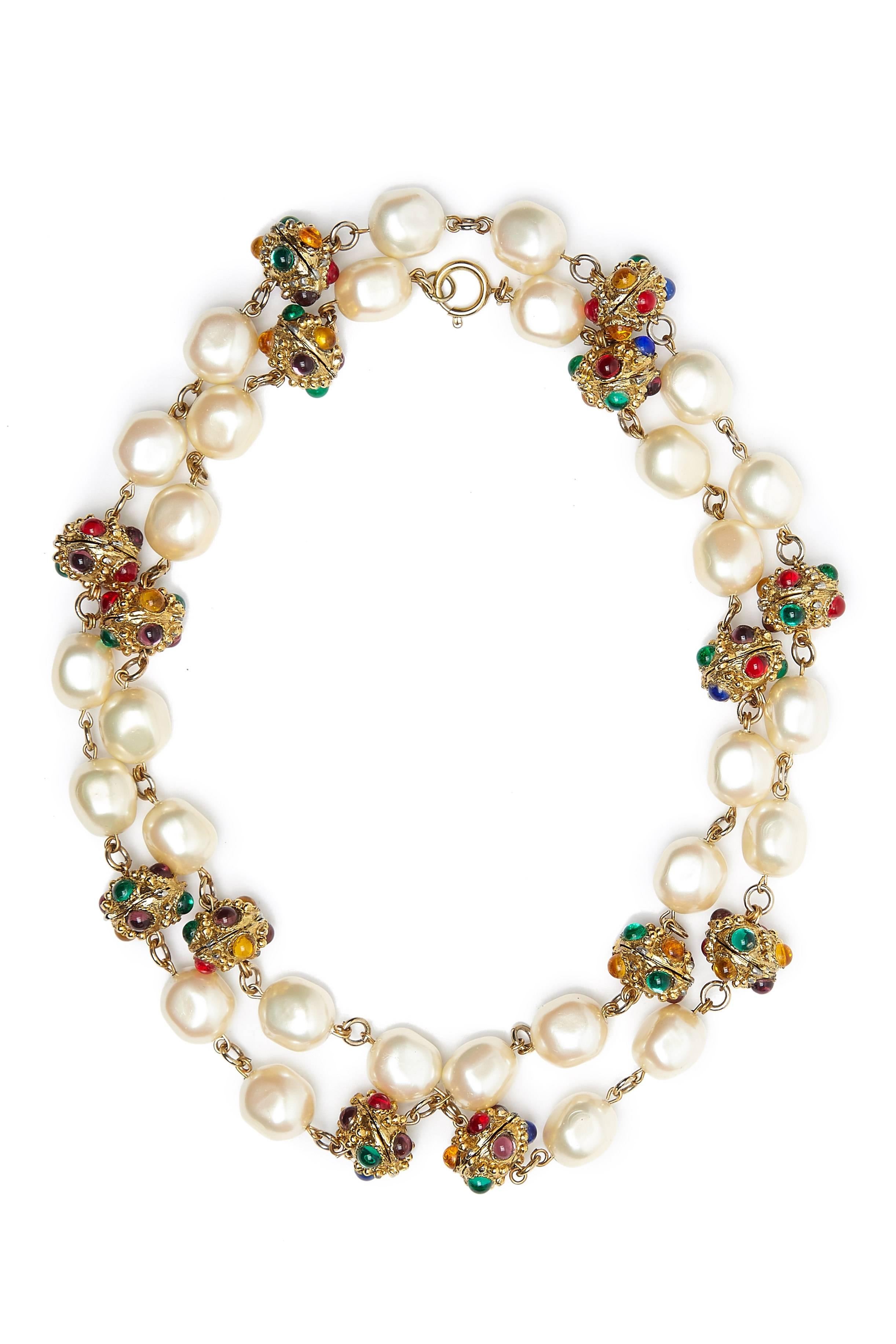 Amazing vintage 1970s statement necklace with baroque pearls and gold tone metal discs with multi-coloured gripoix glass stones. We believe this to be Chanel however the clasp has been replaced and therefore lost the Chanel signature but is typical