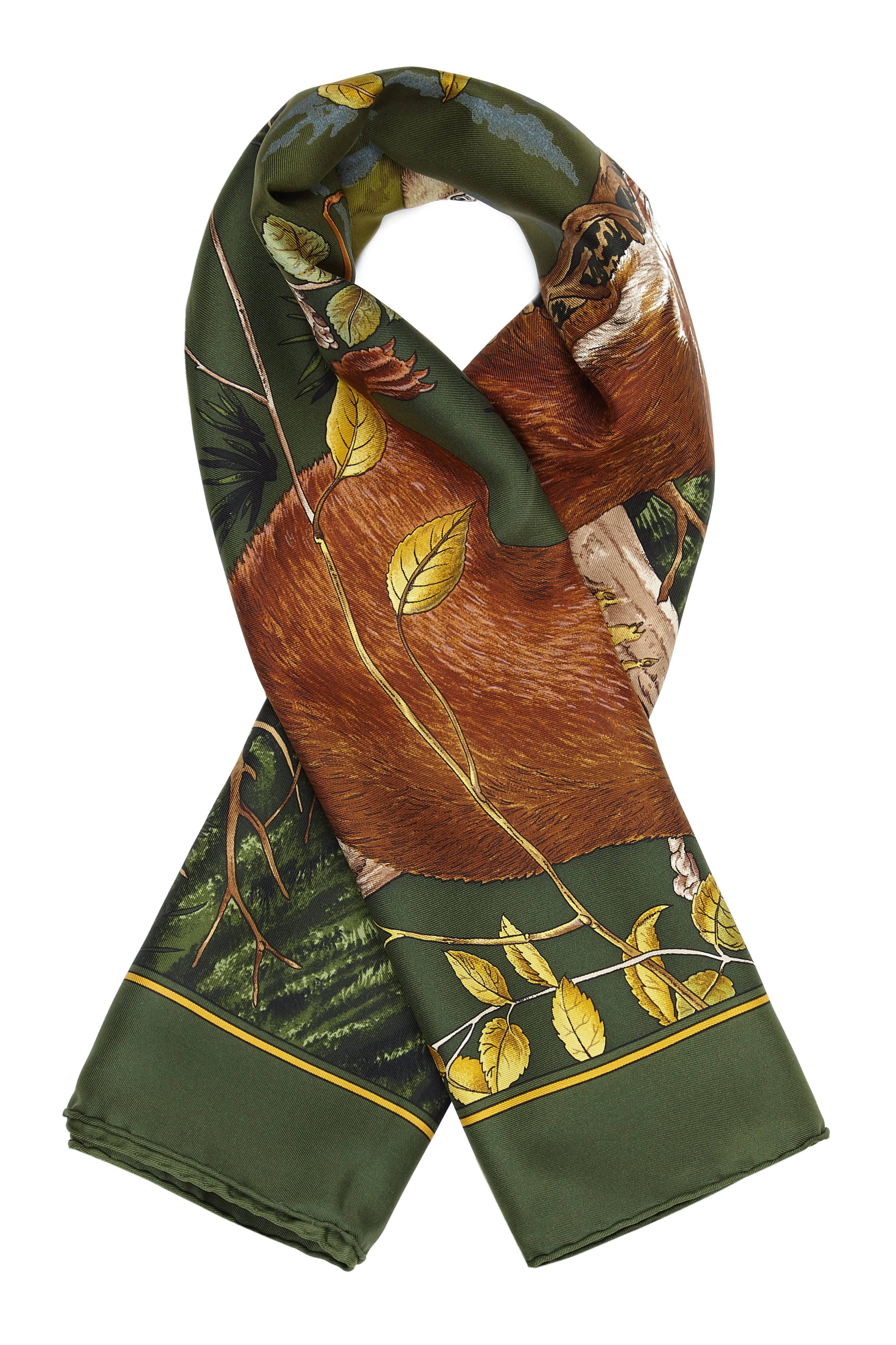 Chasse au Bois vintage Hermes silk twill scarf designed by Carl de Parcevaux literally translated as 'Hunting In The Woods' and features a lovely hunt themed design in green, brown and gold.  This is dated to 1995/6, the first and only issue of this