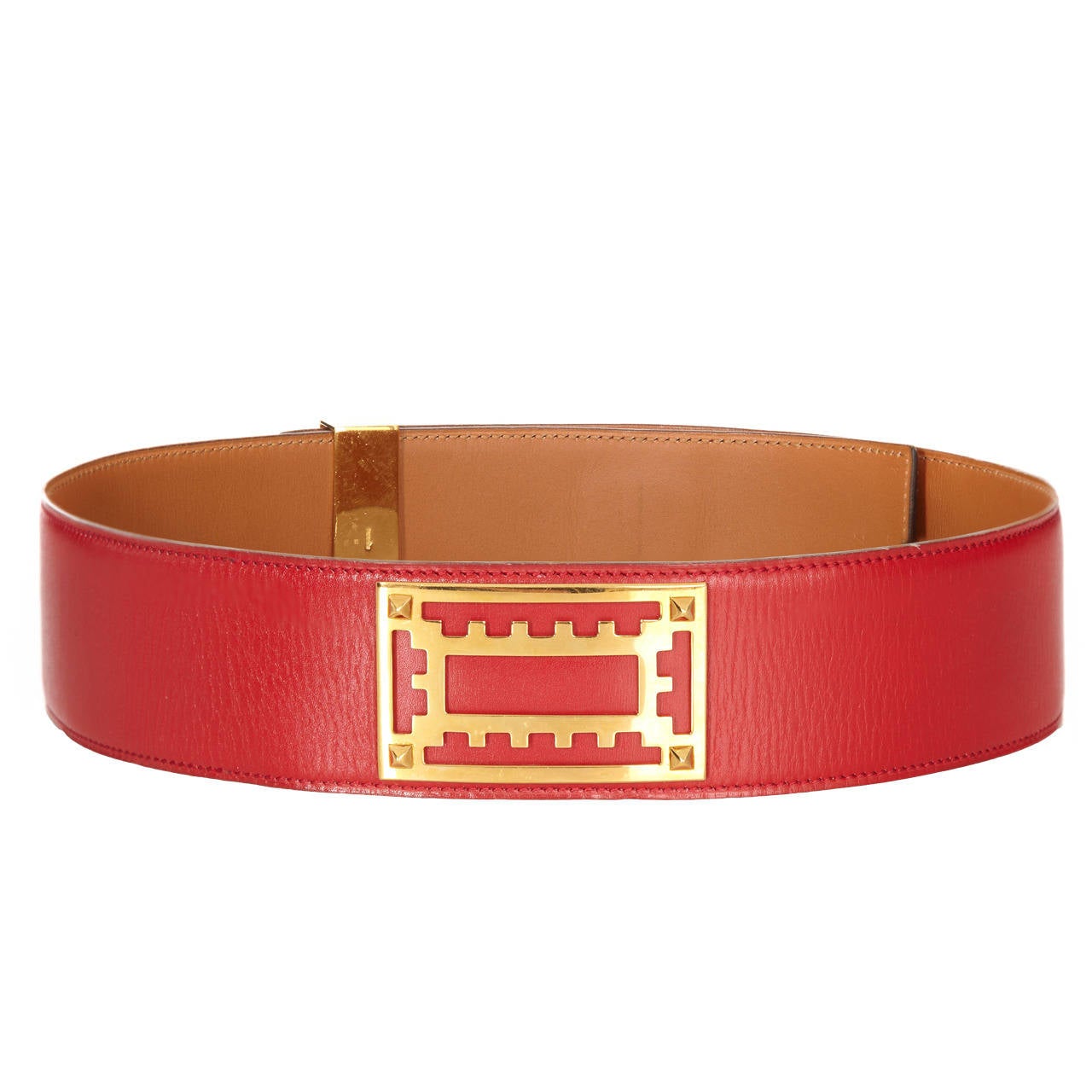 Red Hermès Collier de Chien Leather belt with gold-tone hardware and bar insert closure at front.  Indistinct circular date stamp (looks like a O which would date it to 1985). Very good condition with one very slight abrasion to the leather