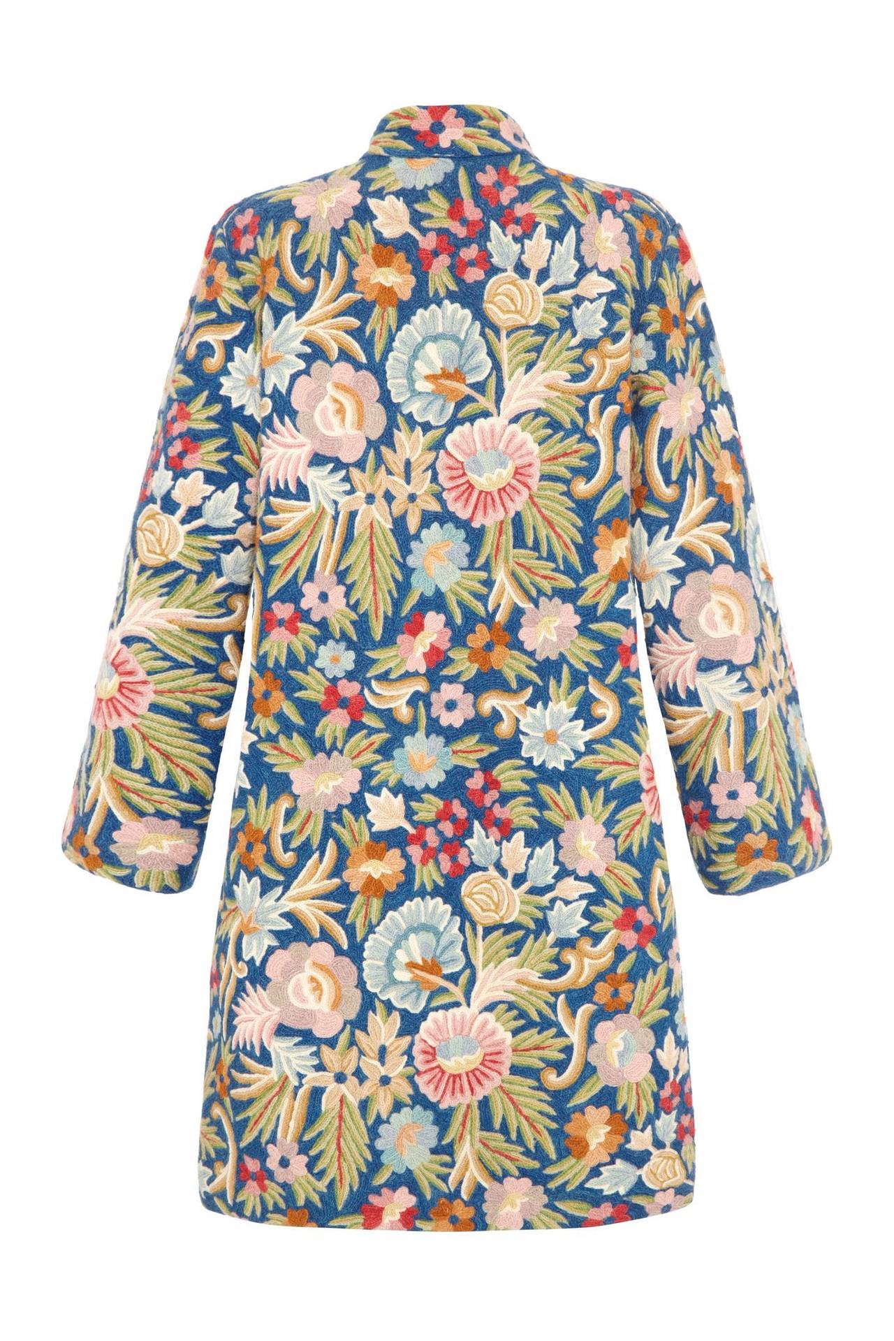 Amazing blue crewel work coat with hand embroidered pink, green and brown floral pattern. Very wearable with a mandarin collar and a slight A-line silhouette the coat has a lovely weight to it and could be worn all year round.  It is fully lined in