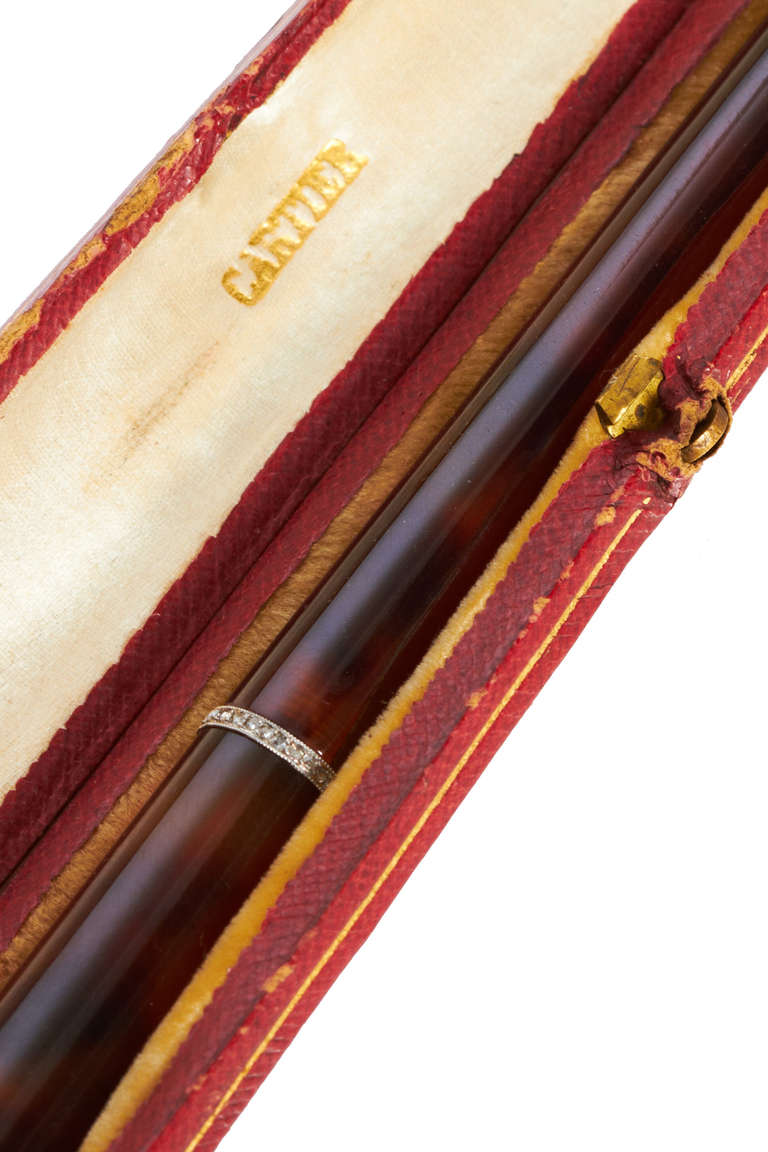 Exquisite tortoiseshell and rose-cut diamond cigarette holder in original maker's tooled leather and silk lined case; circa 1925.  It is marked with the French assey mark for platinum and stamped 
