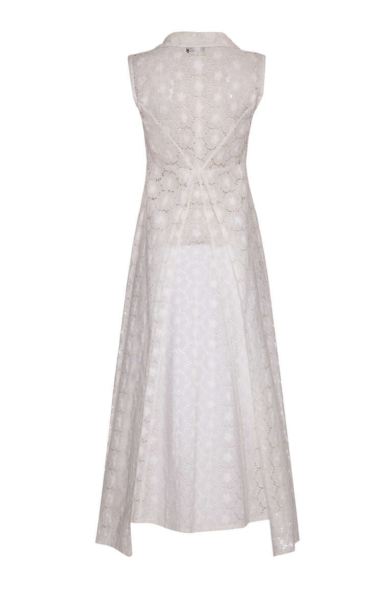 A great Chanel piece from the early 90’s this white lace dress is a real must have! It is full length and sleeveless and features a pretty collar and slightly longer overlays on the sides of the skirt, with 2 pockets to the hip. Fastening with a
