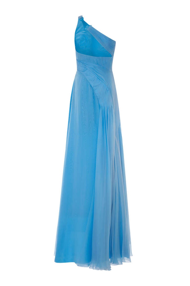 Gorgeous full length $7k turquoise silk chiffon gown by Versace, circa 2000s.  This asymmetrical, one shoulder dress has beautiful pleating detail wrapping around from the right bust on the front to the hip on the back which then flows to the floor.