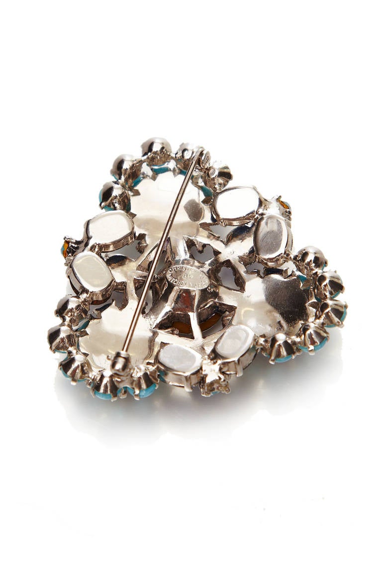 A classic 1950’s brooch by Mitchel Maer for Christian Dior. Faux sapphire and turquoise stones combine in a style that is typical of the era. Marked on the reverse and in excellent condition with no loose stones, this would make a fantastic piece