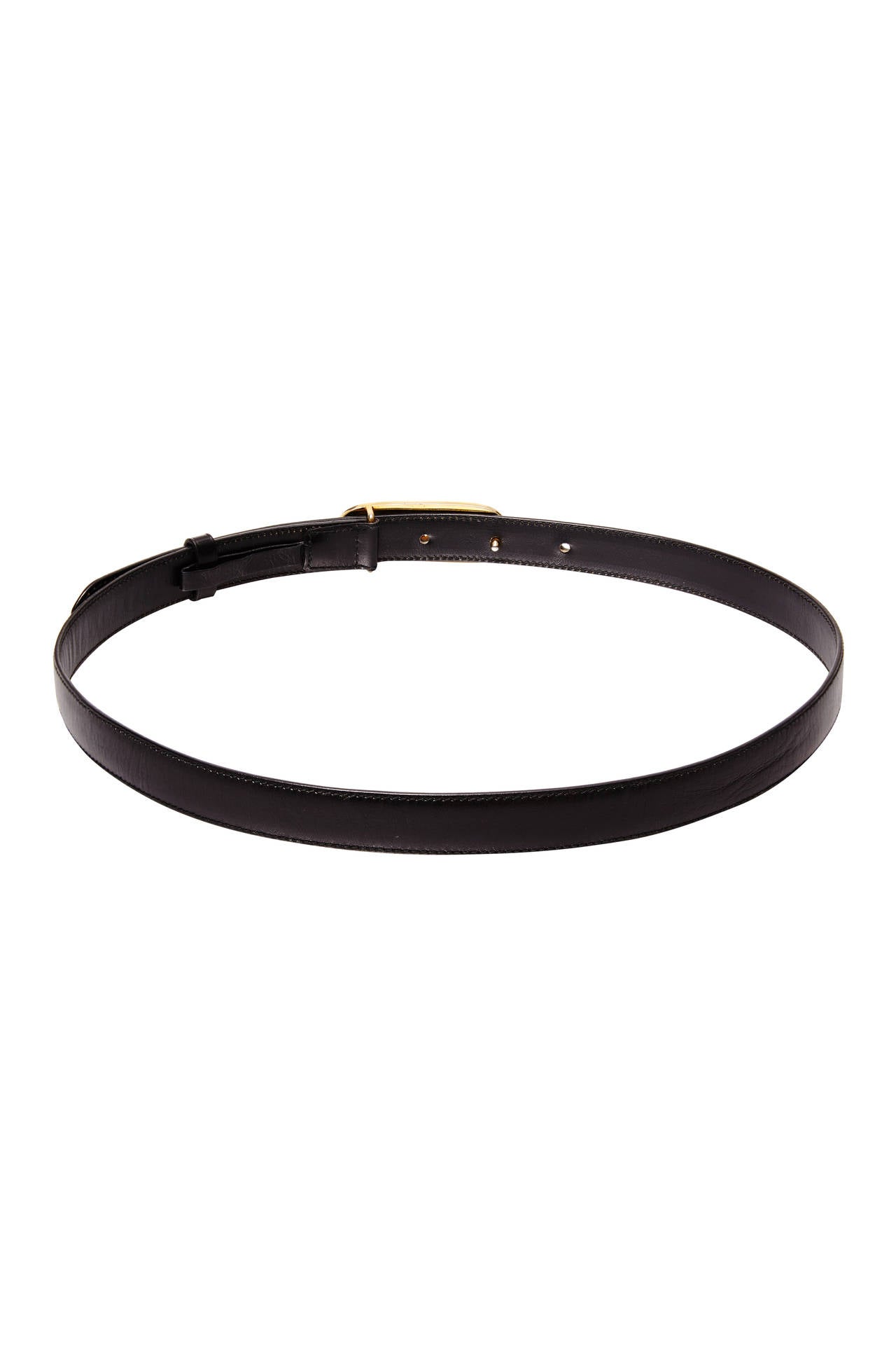 Beautiful black leather belt by Celine with gold tone metal and black leather buckle to fasten featuring the Celine logo.  It has five holes to fasten making the belt between 75cm/29.5 and 86cm/34” when fastened so could be worn at the waist or hips