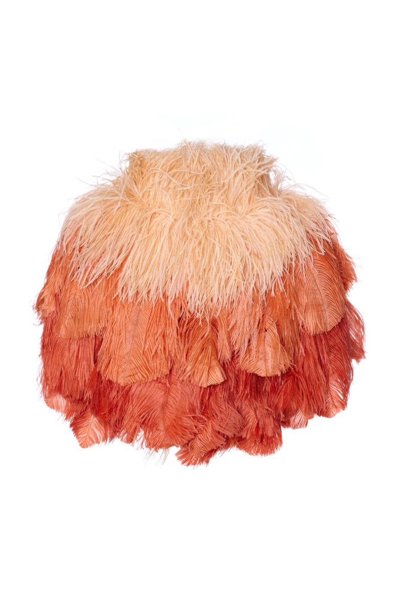 A really beautiful piece this graded peach ostrich feather boa/cape is loads of fun and is a great way to add a splash of colour to any outfit. The three layers of feathers are attached to a very pale pink georgette interior with the same pink