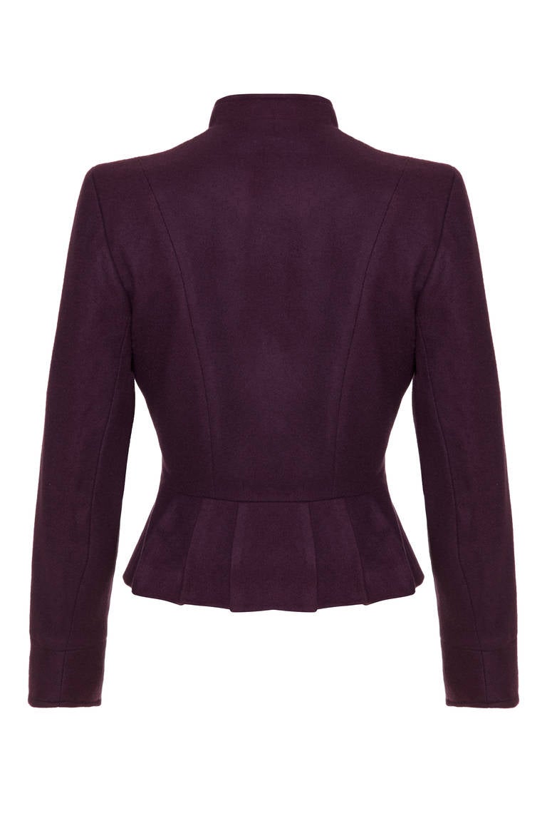 Fabulous little aubergine wool jacket from iconic British designer Mary Quant.  It features a very current peplum hem and mandarin collar with five matching buttons to fasten down the front. It is fully lined in excellent condition.