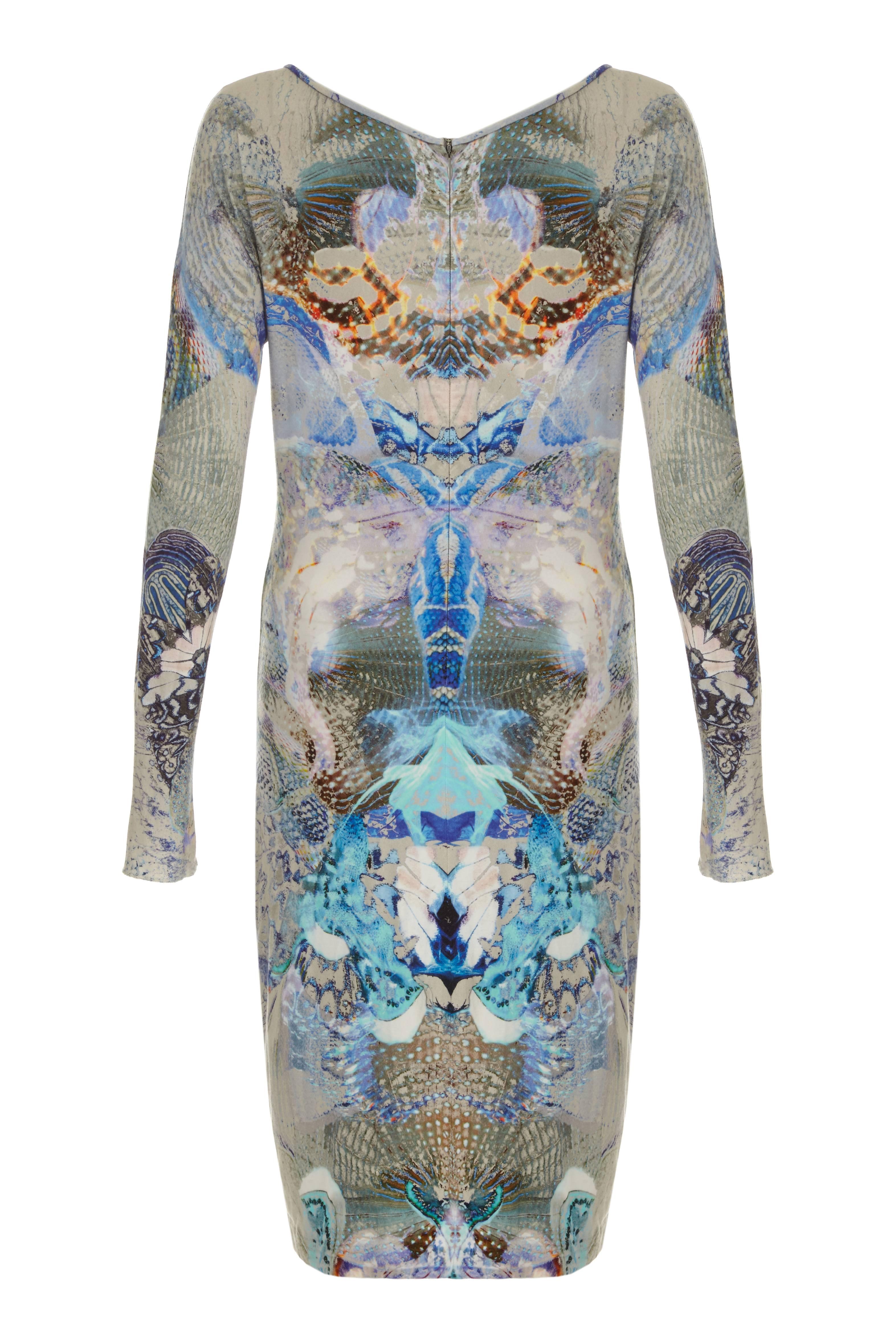 A rare and super collectable Alexandre McQueen dress from Lee McQueens very last collection Plato's Atlantis, Spring/ Summer 2010. This long sleeved jersey dress, made up of 94% viscose and 6% elastane is printed in blues, greys and orange. It