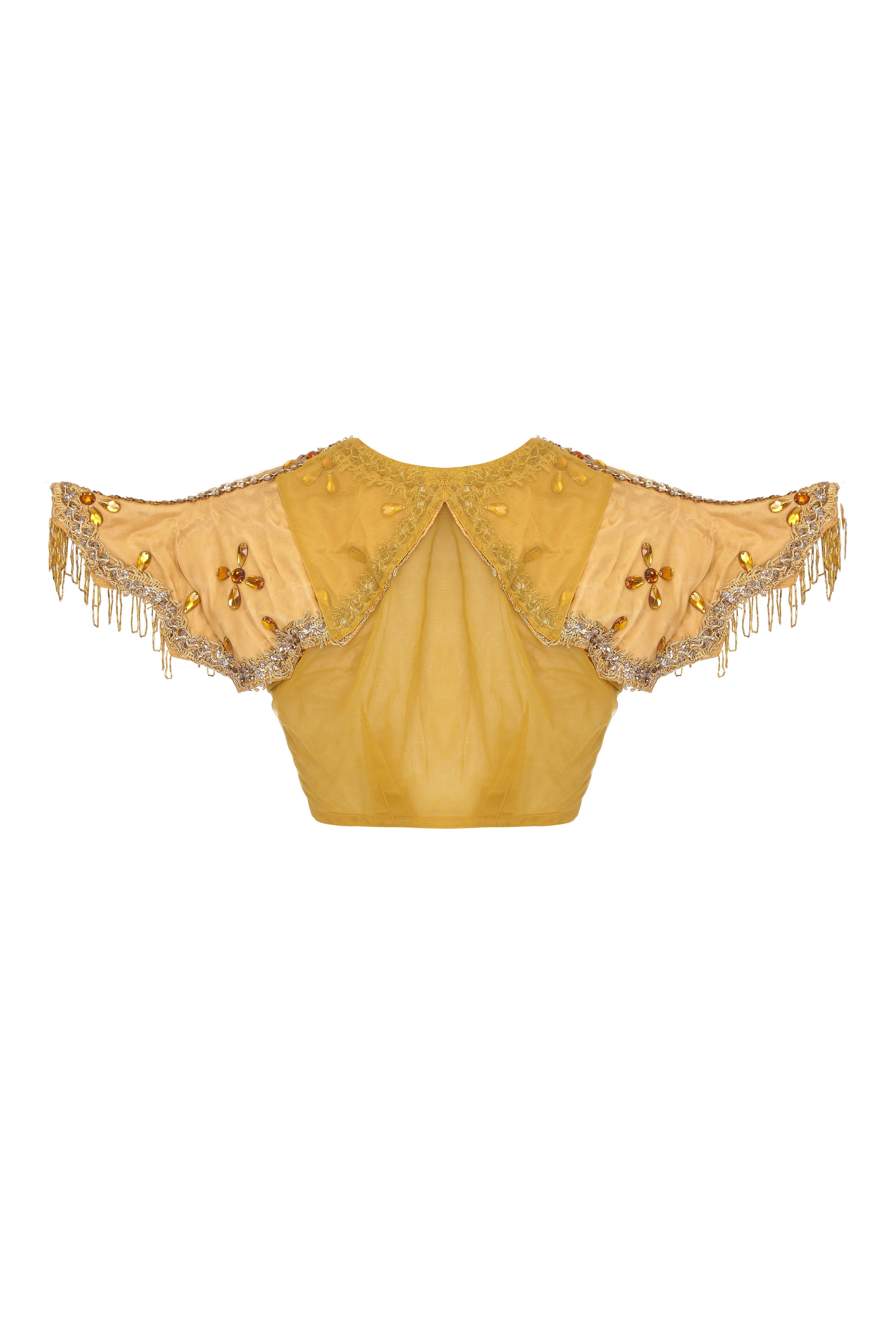 Incredible vintage 1930s Mardi Gras costume from New Orleans with exaggerated shaped and tassled shoulders.  The body of the top if made of a gold mesh and is heavily embellished with gold cord, sequins and jewels.  It is cropped and fastens under