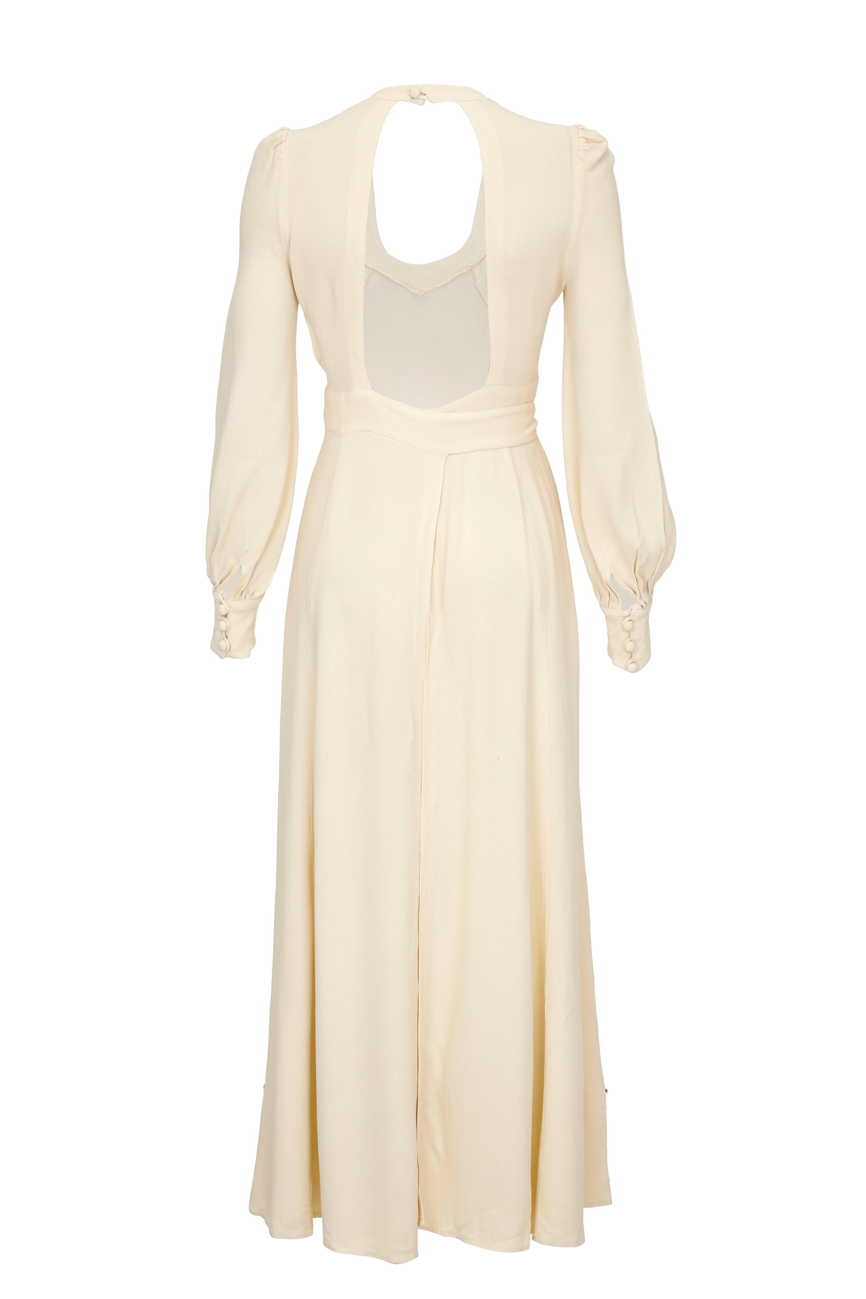 Beautiful vintage 1970s Ossie Clark for Radley moss crepe, full length wrap dress.  In classic Ossic Clark style it features cuffed long sleeves, open back and tie at the waist.   It is slightly flexible in size due to the wrap style but we feel