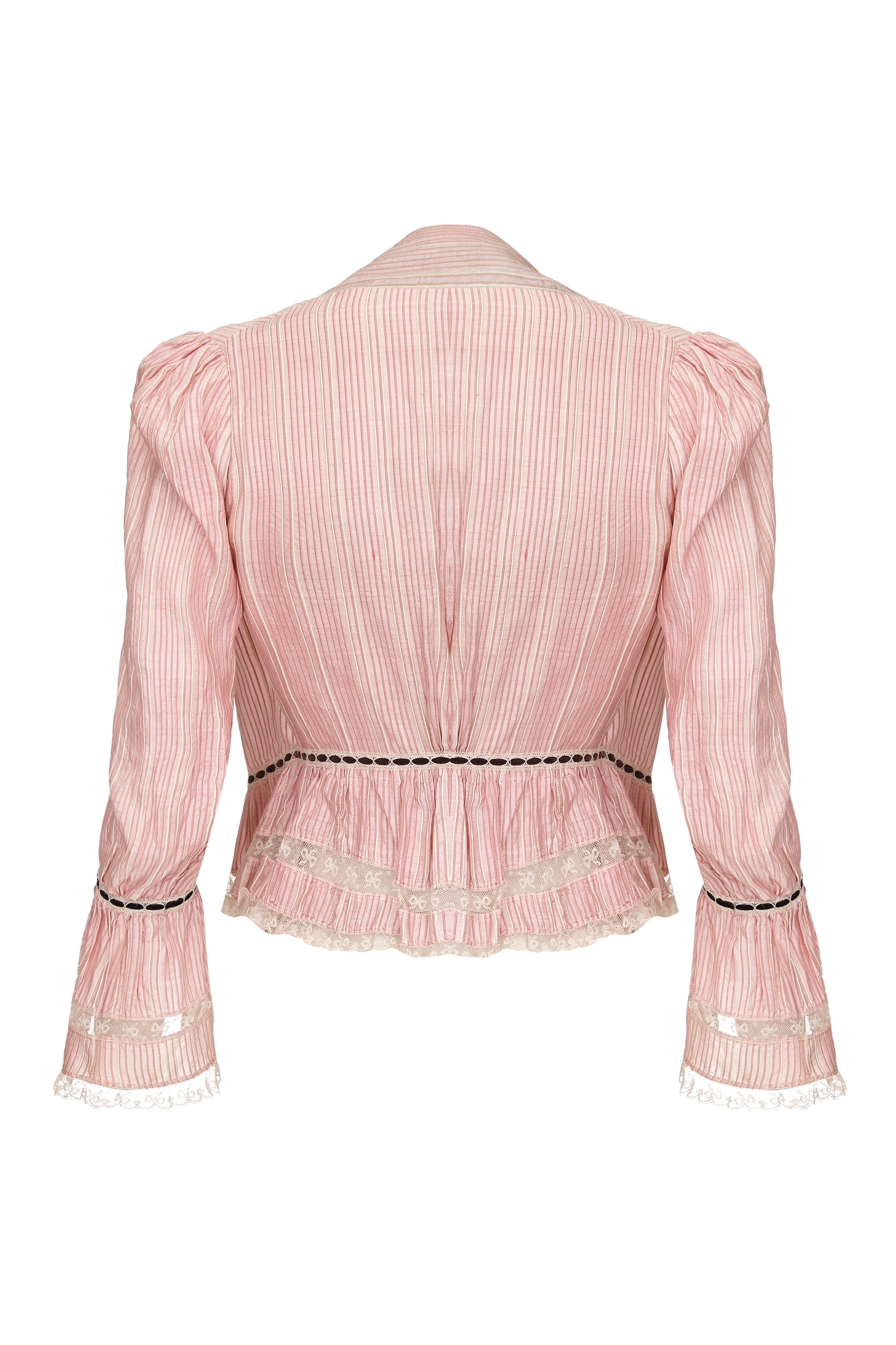 Wonderful and entirely original, as found, antique Victorian Civil War era pink silk stripe flounced sleeve bodice dating to around 1860. The corsage has stripes of both white and a more peachy coloured pink silk.  With a high neck collar the bodice