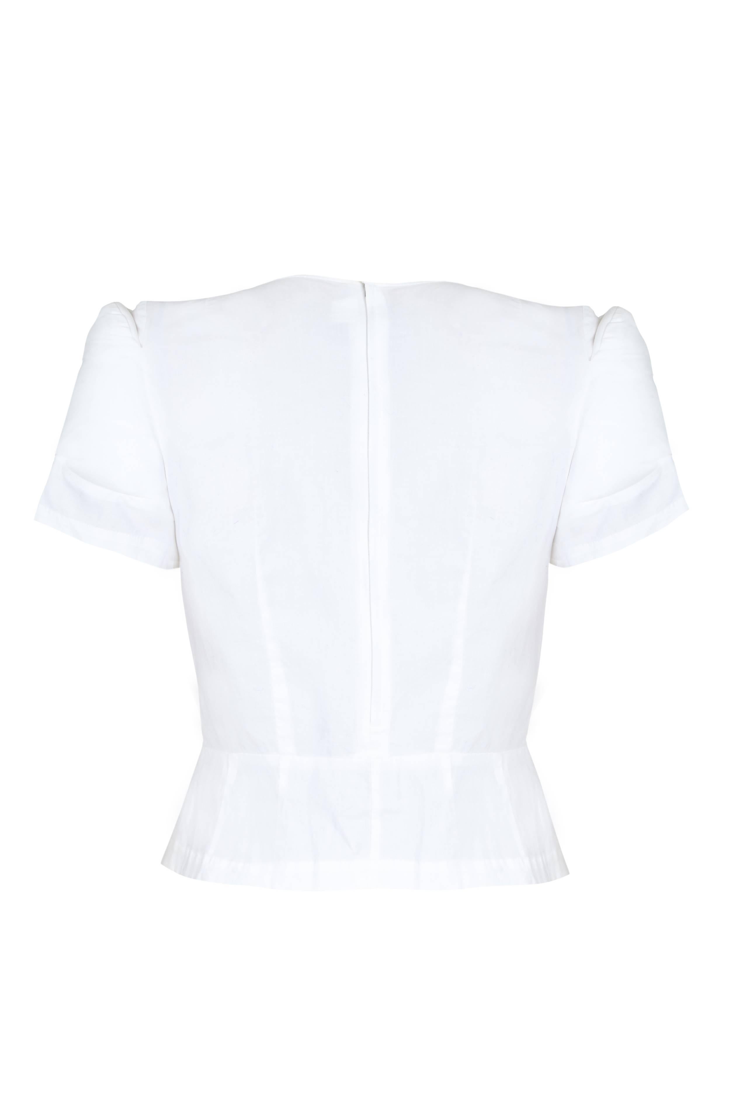 White cotton top by Comme des Garcon with removable padded sections. Fastens at the back and side with zips and is in excellent condition.  Labeled size Medium which is the equivalent of about a UK 12, US 8.