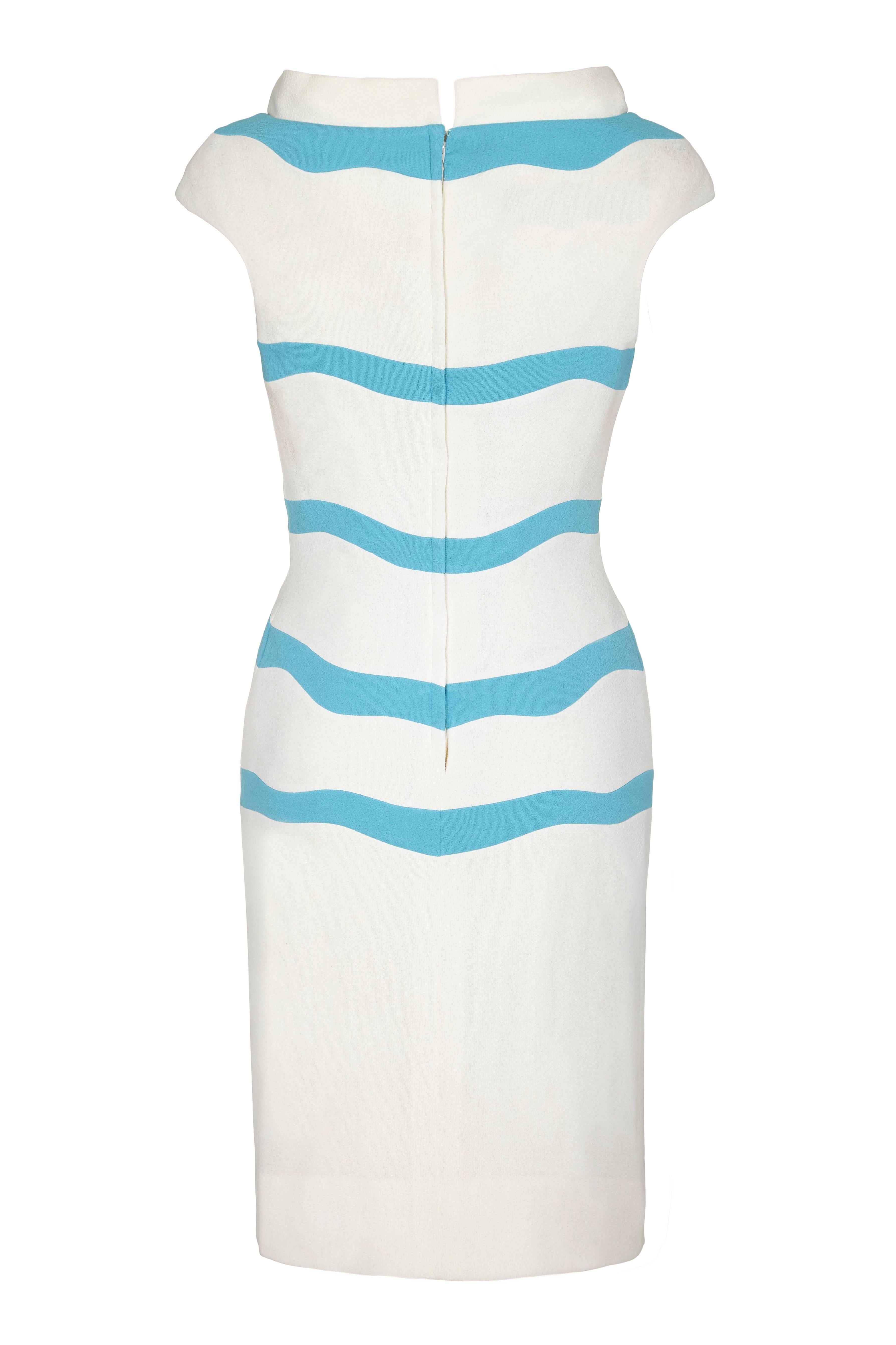Fabulous vintage 1960s blue and white striped dress by American designer Sydney North.  This is a classic, bold 60s design and is very fitted with an open boat neckline.  It fastens at the back with a zip and is in very good condition with just a