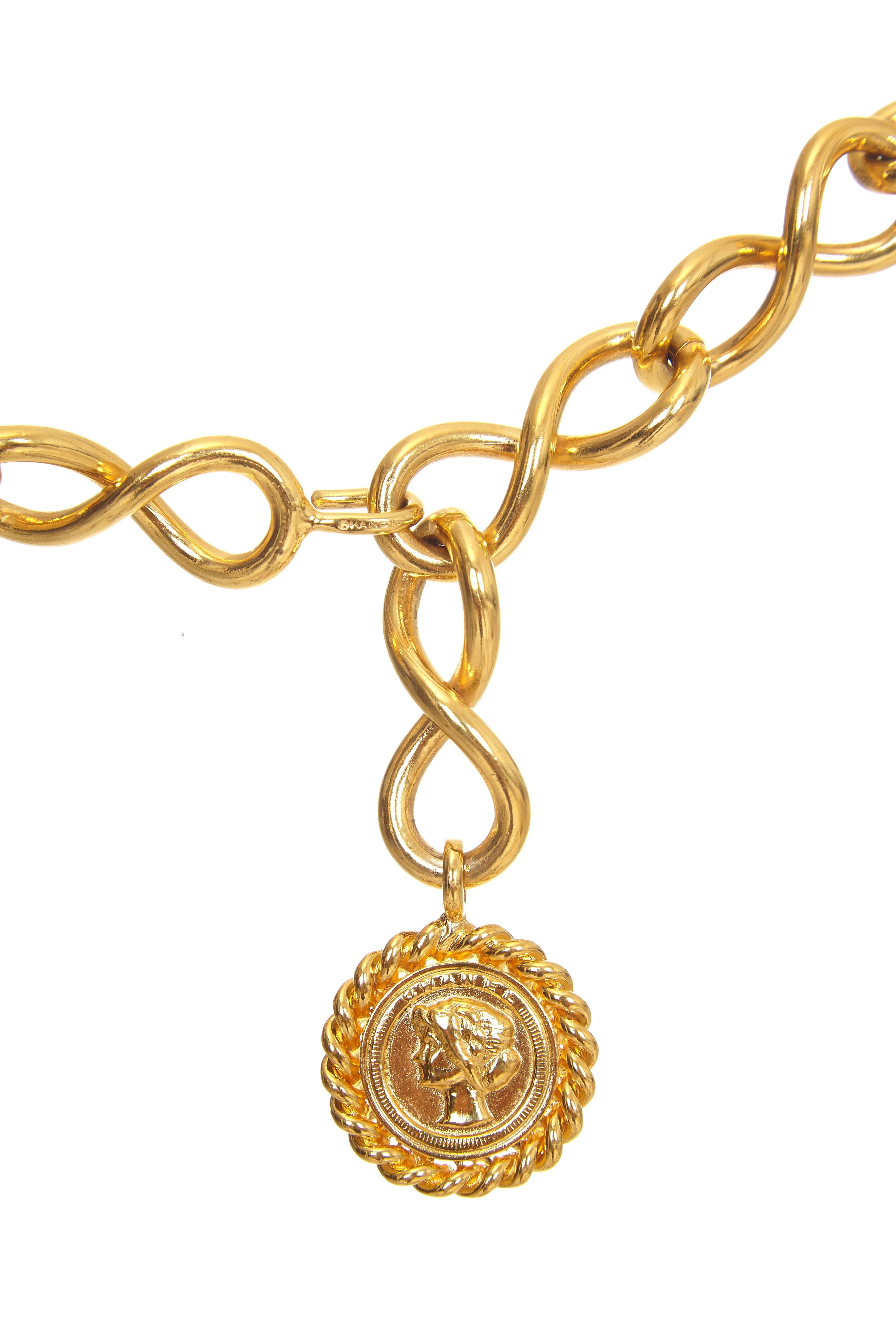 Classic 1980s early 1990s vintage gold gilt metal Chanel belt with medallion charm featuring the head of Gabrielle 