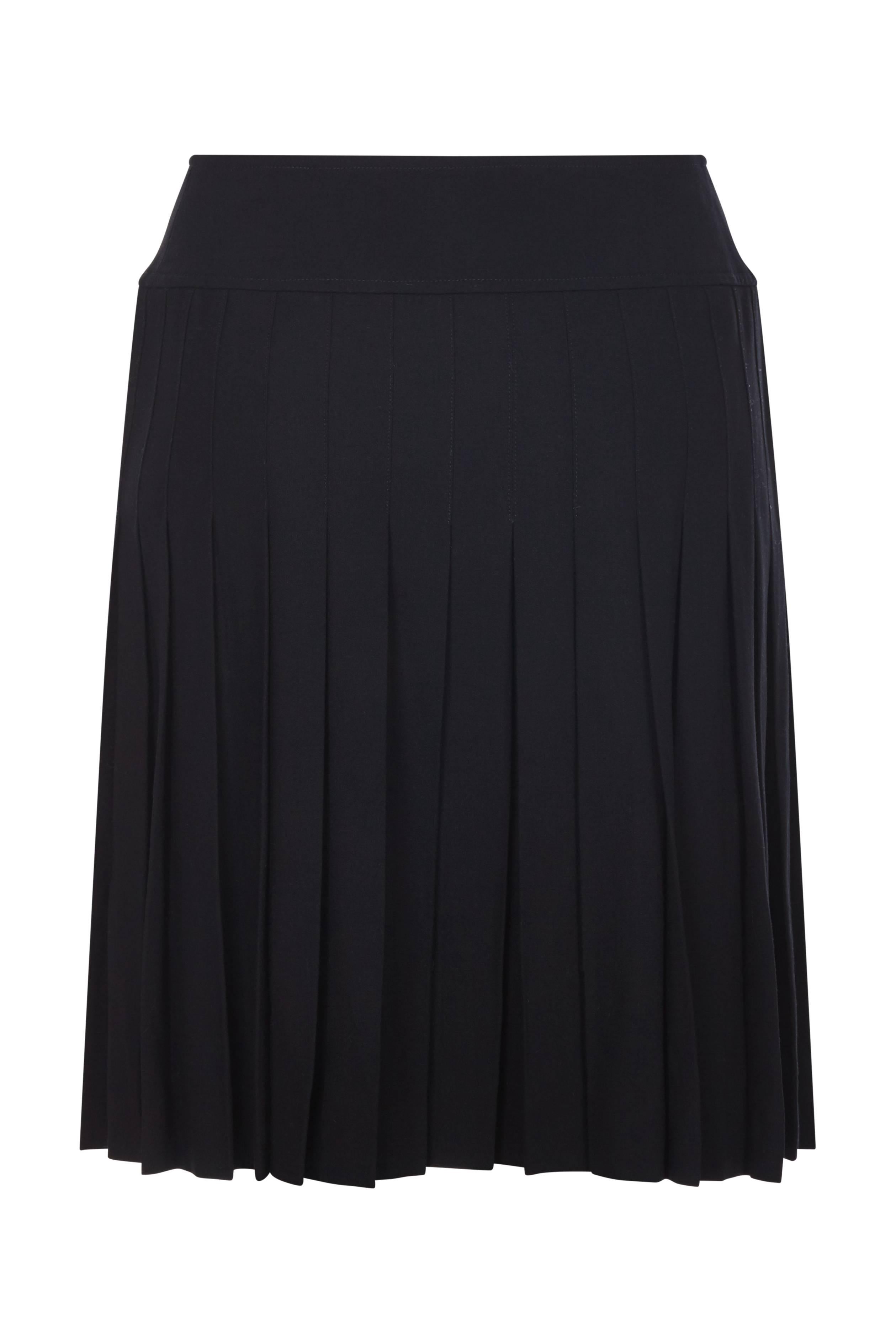 This 1994 collection Chanel black pleated skirt is 100% pure wool, of excellent quality and has a timeless smart feminine style. A high rising, wide, neatly tailored waistband atop of smart rows of stitched pleats creates a flattering fit against