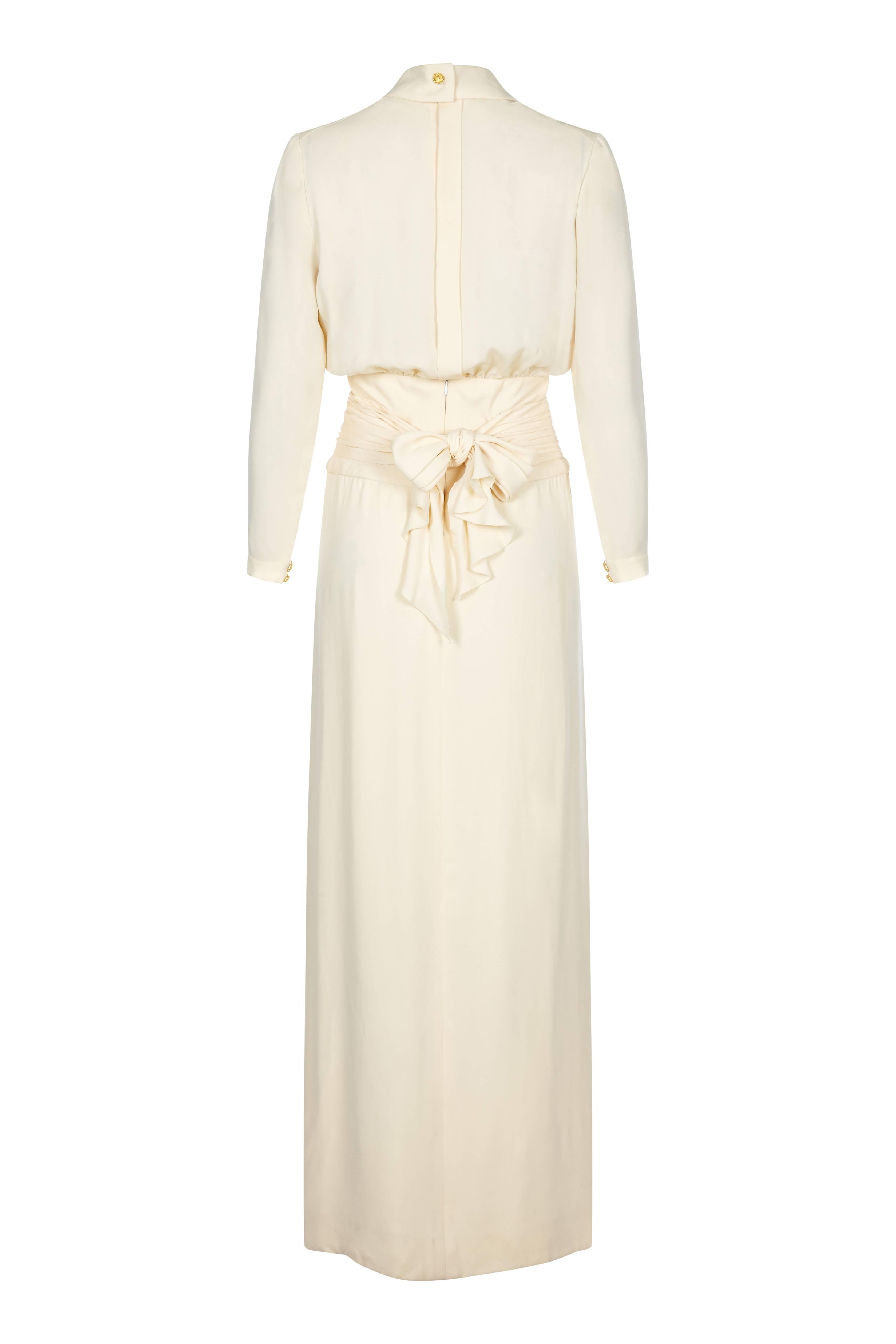 This very special Chanel 1980s silk pleated dress exudes simple elegance alongside a wealth of fine details. The dress is 100% pure silk crepe in soft cream; whilst the long skirt and front of the bodice are fully lined, the sleeves and back of the