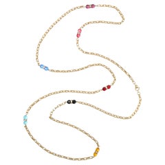 Collana a corda con catena dorata degli anni ’70 e perline di vetro sfaccettate