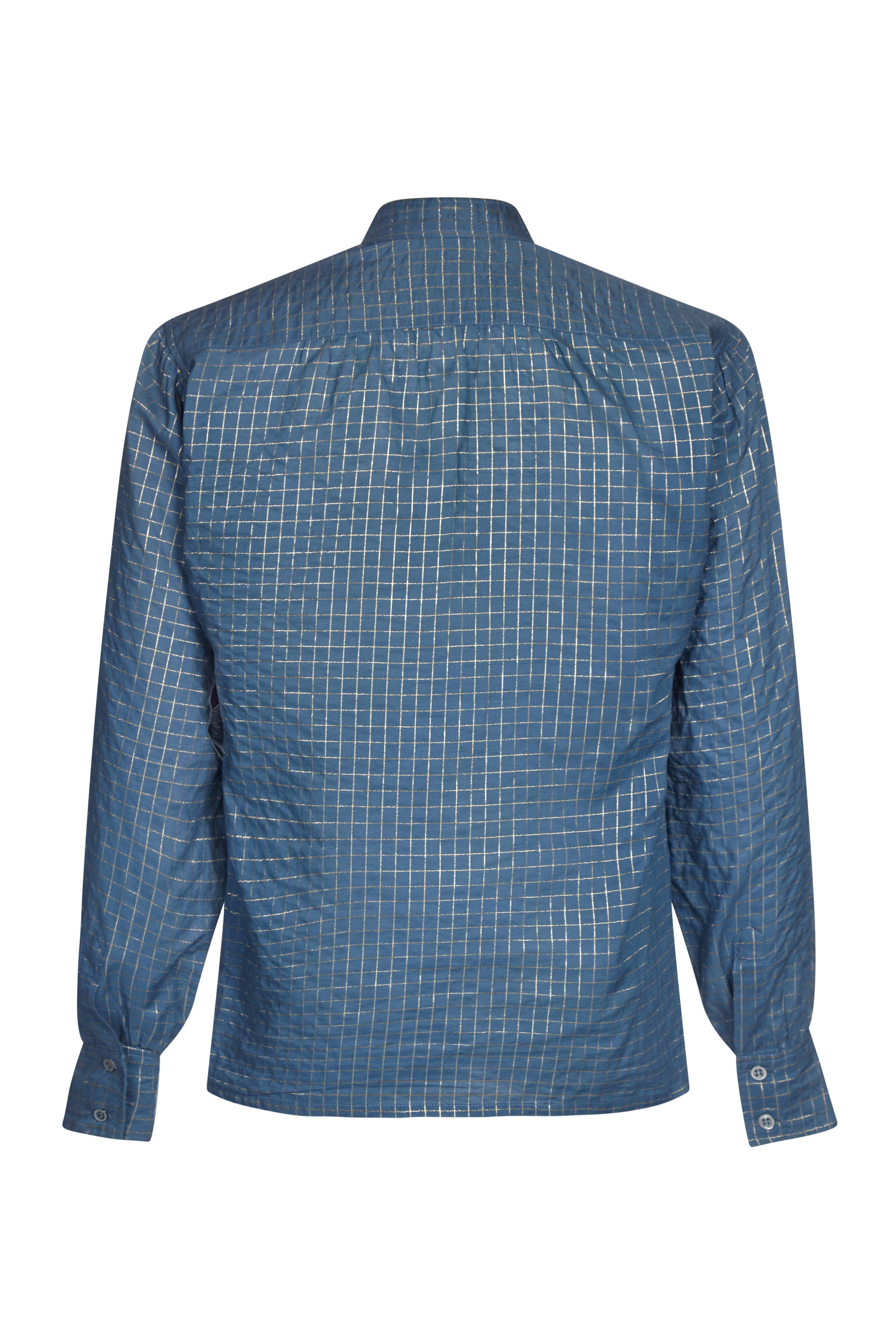 Original Yves Saint Laurent 1970s French blue and metallic gold thread checked blouse / shirt.  A high necked collar and cuffs, the shirt is a loose fit style designed to be tucked into the high waisted skirts and trousers of the era.  In superb and