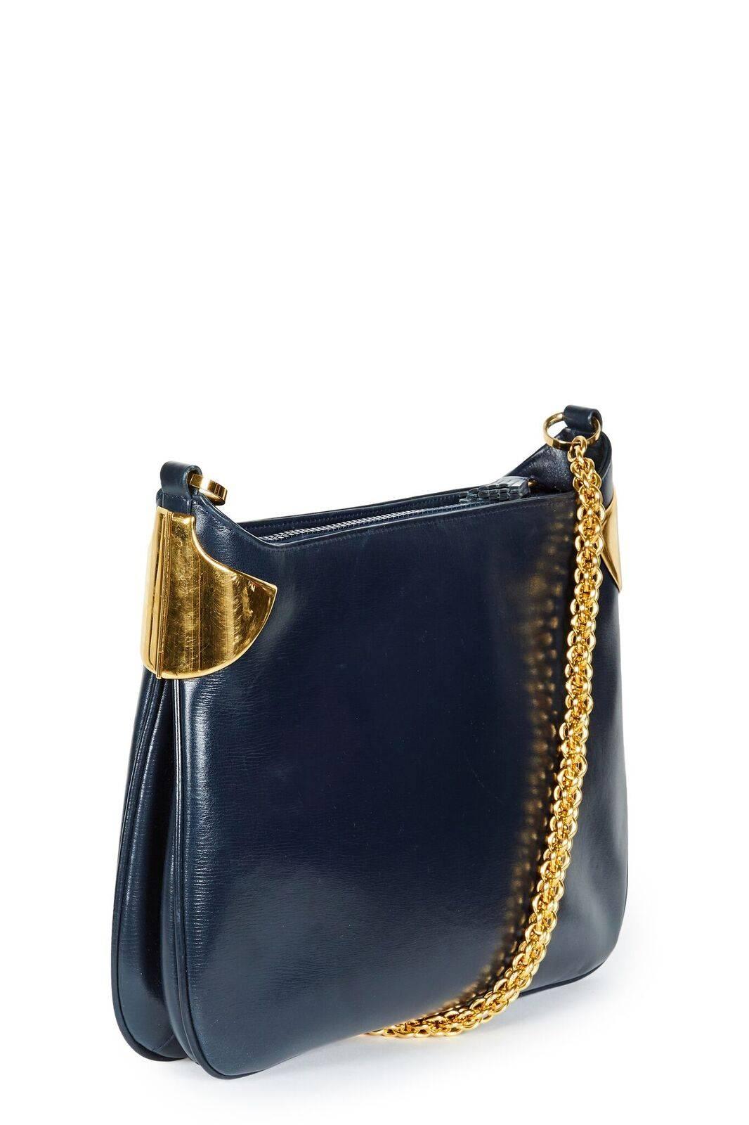 This is a fabulous vintage early 1980s or late 1970s Gucci leather chain shoulder bag suitable for all occasions.  It is made from soft and supple navy blue leather and has a beautiful and weighty gold-toned chain and hardware throughout.  The