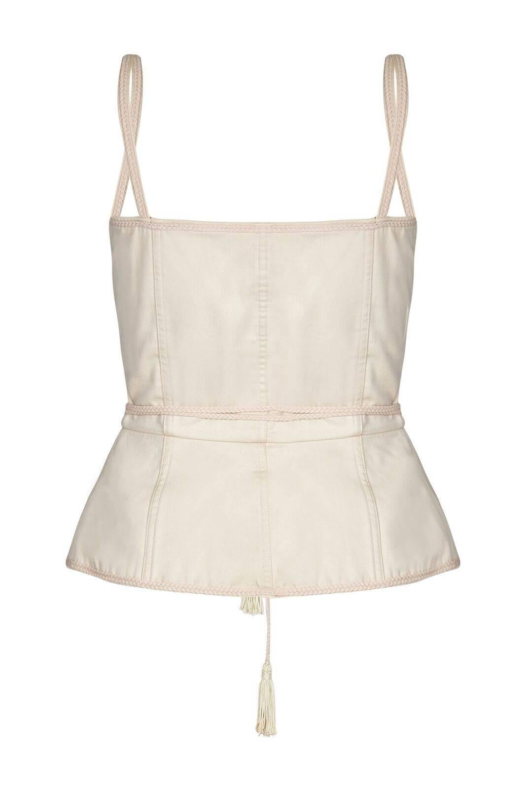This iconic Yves Saint Laurent ivory beige cotton peasant corset top with front lacing is part of the designer's revolutionary Russian collection of Autumn/Winter 1976. Instantly recognisable, this highly sought after piece features a seven-hole