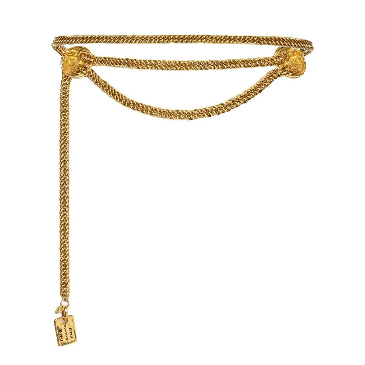 This timeless 1980s 31 Rue Cambon chain belt from Chanel features 2 x 31 Rue Cambon embossed disc medallions. There is a concealed hook fastening behind the medallion to the left that attaches over the chain at any point so that the length is