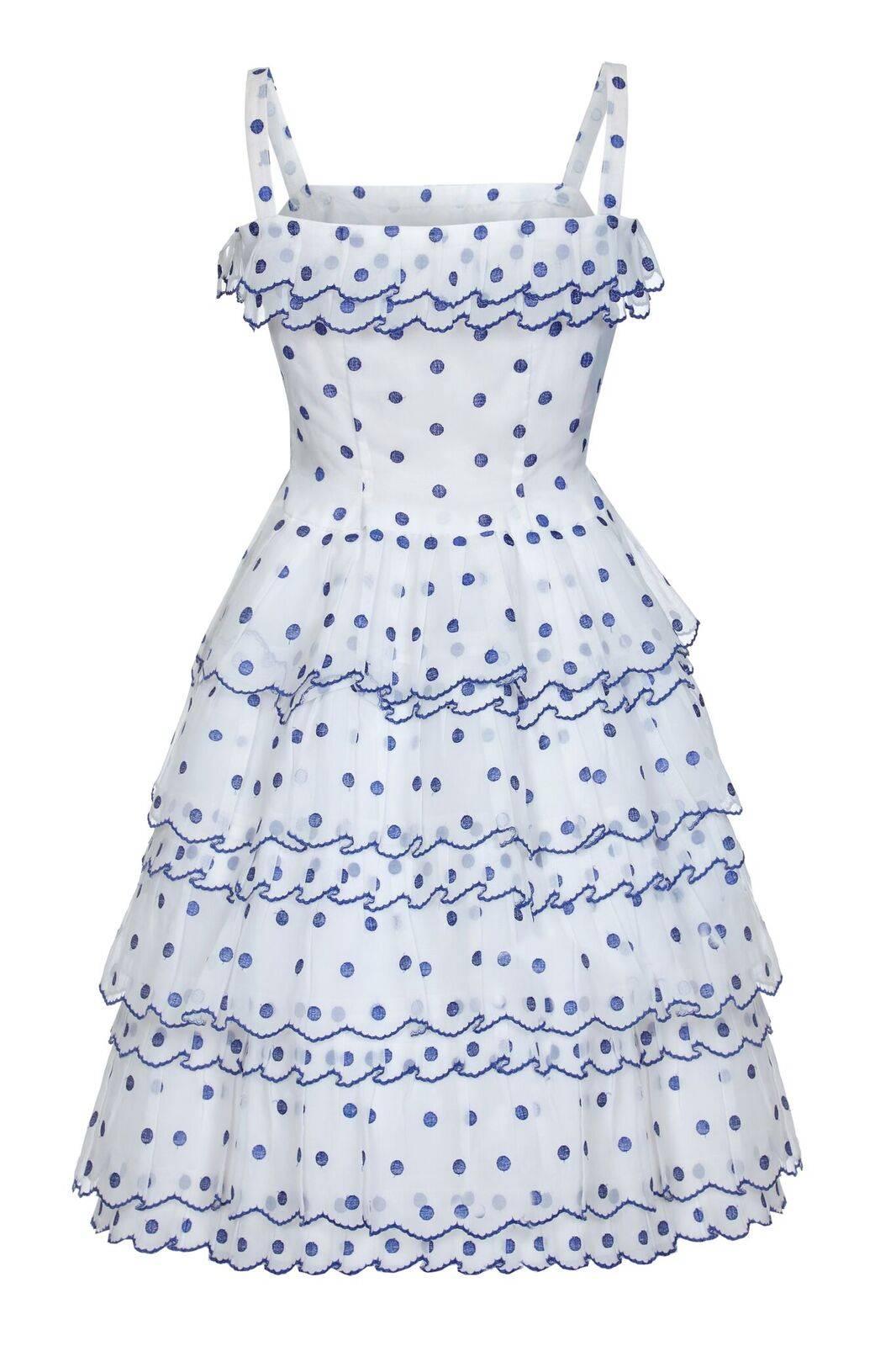 This charming vintage French couture dress in white and blue polkadot organza is beautifully constructed and a perfect Summer occasion piece. There is a 