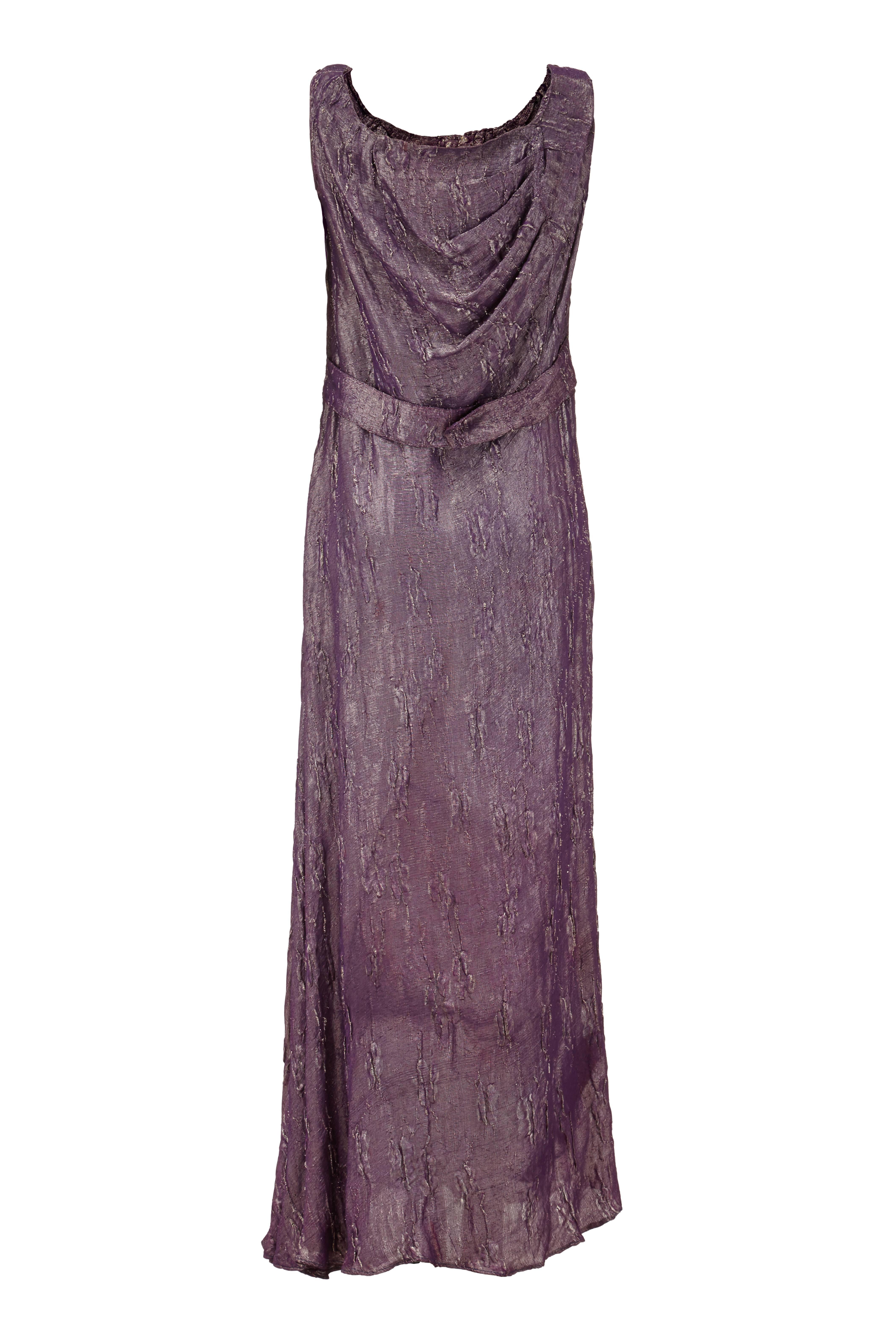 Amazing textured purple full-length vintage 1930s dress with gold lame threads throughout making this piece very striking and perfect for the party season. It has a scoop neckline and pretty draping and a half belt at the back. In very good vintage