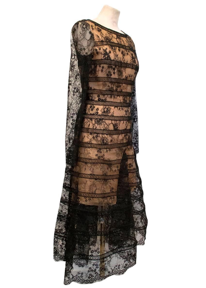Spectacular, timeless Oscar De La Renta long sleeved black lace overlay midi dress. Banded lace panels add fullness and volume to the skirt. Chantilly lace with scalloped edging on the sleeves and hem. 

- Made in Italy
- Lined in Silk
- Boat