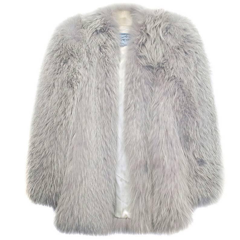 Prada blue fox fur coat. Item has some marks to the collar which can be seen in image 9, however this does not affect the beauty of the coat. 

Specialist cleaning only.
Condition 9/10.
Made in Italy.

100% SILVER FOX FUR, LINING 60% ACETATE