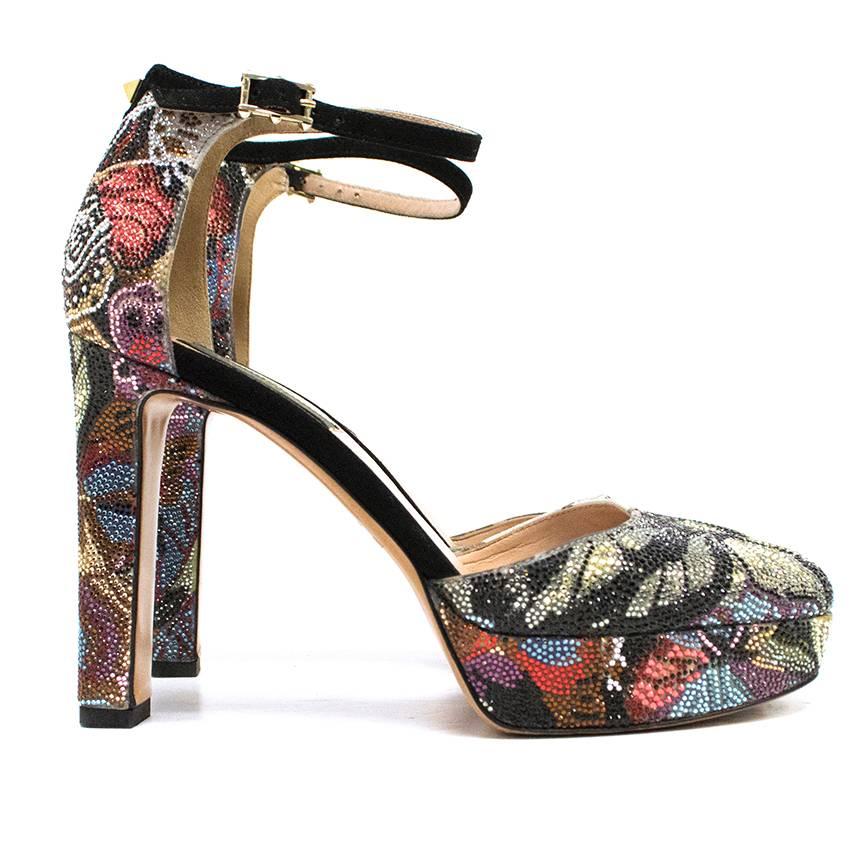 Valentino pumps from the 'Camu Butterfly' collection featuring a floral print and encrusted with Swarovski crystals. The pumps have a platform, square heel and suede ankle strap. Dust bag and box are included. 

Made in Italy. Size EU 36. Great