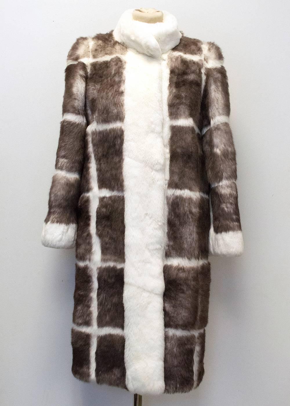 Matthew Williamson checked taupe and cream rabbit fur coat. Long line with a relaxed fit, the coat is medium weight and the sleeves are cropped to the wrist. Soft to the touch with a high neck round collar and two slip pockets at the front. Fully