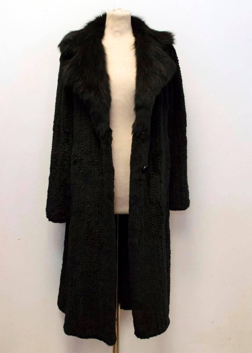 Hockley black rabbit fur long coat with a collar, long sleeves, two button front closure and two side pockets. Very soft to the touch with no visible stitching. 

Specialist fur cleaning only.

Condition:10/10

100% RABBIT FUR

APPROX
