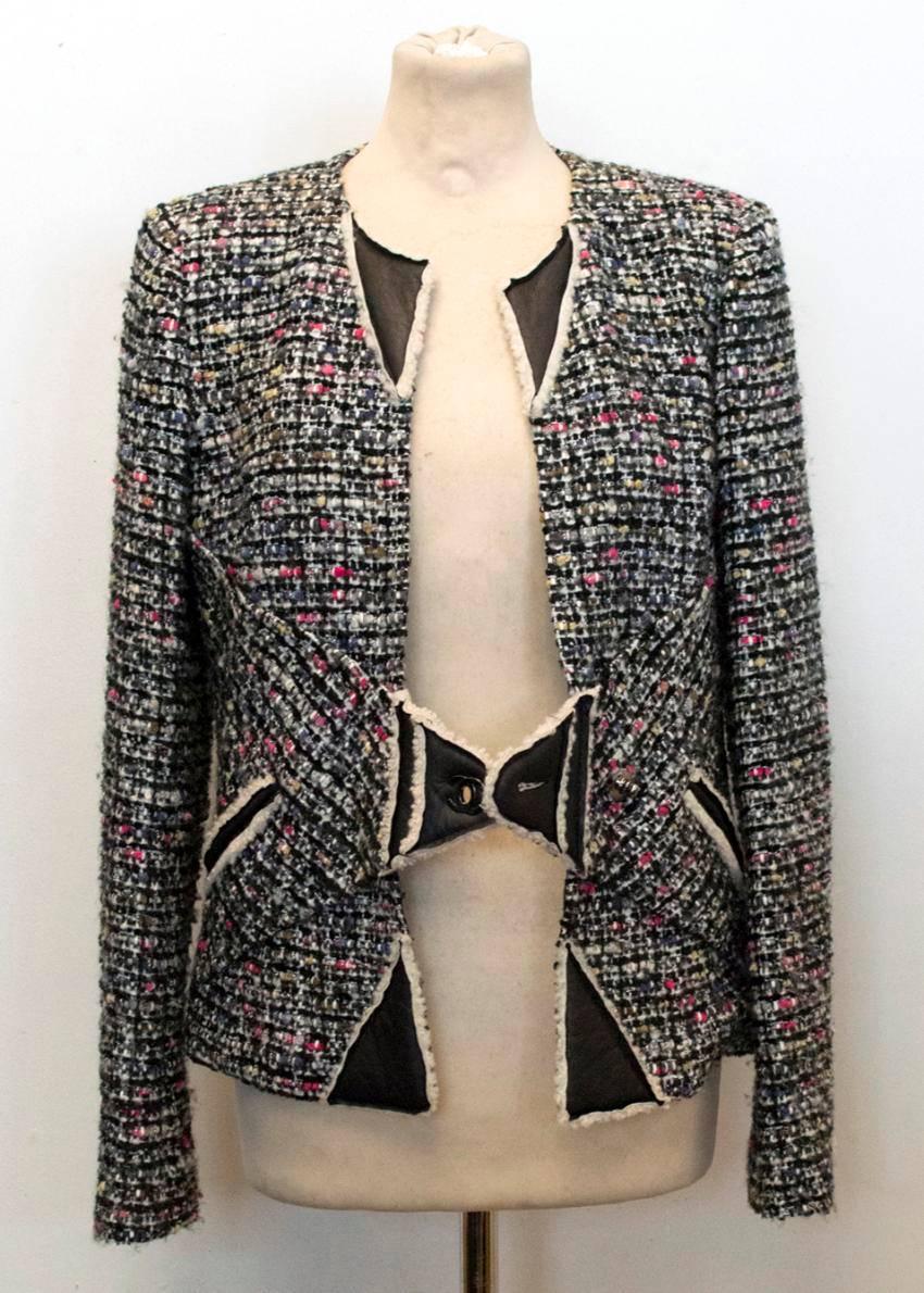 Chanel multi colour tweed jacket with lamb leather, shearling trims and classic lock turn. Two small jetted pockets, one on each side and padding in the shoulders. Fully lined with printed silk.

This item belongs to Caroline Stanbury from 'Ladies