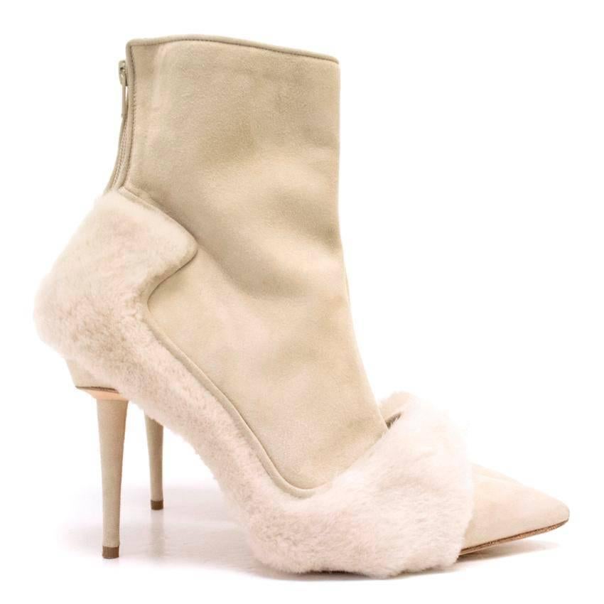 Manolo Blahnik suede cream pointed ankle boots with shearling fur trimming detail around the edges. 

Some storage marks to the soles (please see image 8). Slight mark to suede on right shoe, and bottom of heel on right shoe (please see images 5 &