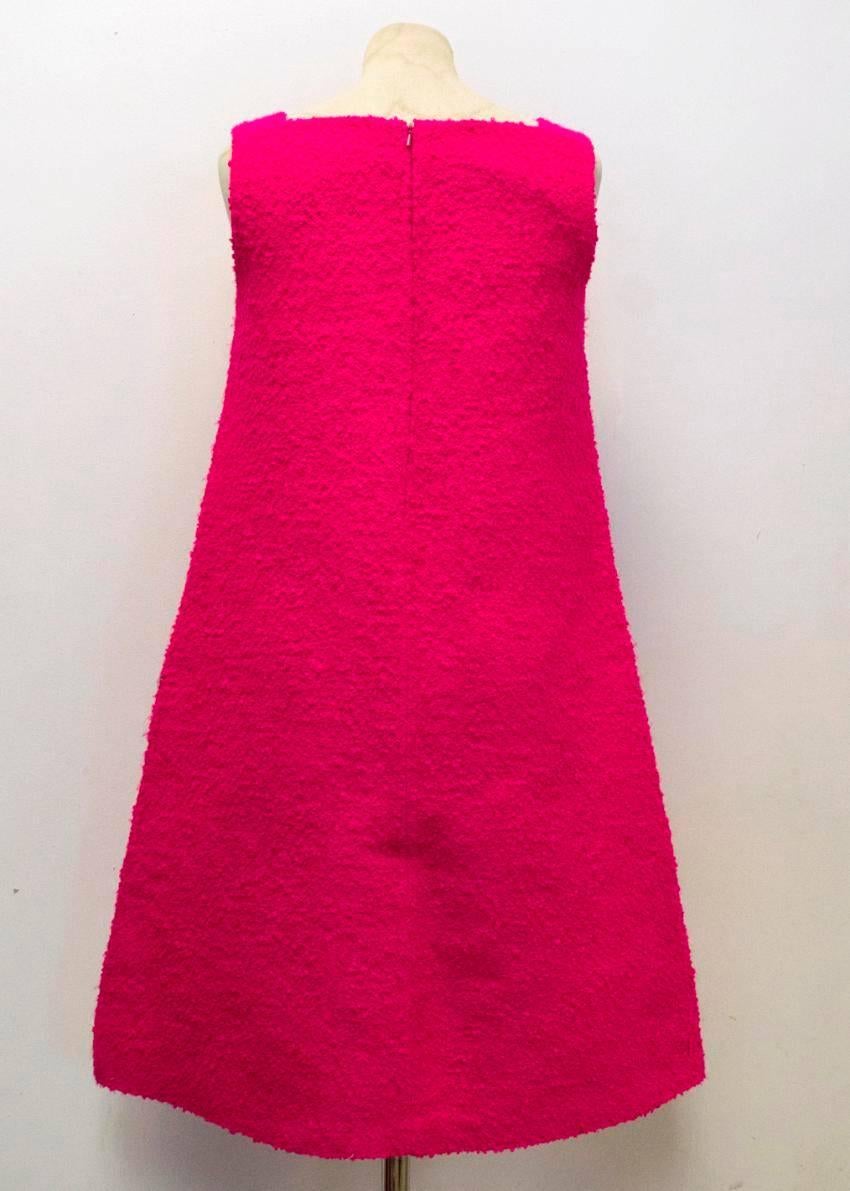 Osman bright pink textured a-line dress with two side pockets with a long pink invisible zip fastening. Medium weight with a square neck.

Condition: 10/10

50% ACETATE, 50% SILK

APPROX  MEASUREMENTS:  
BUST - 42.5CM 
LENGTH - 91.5CM

Size UK: