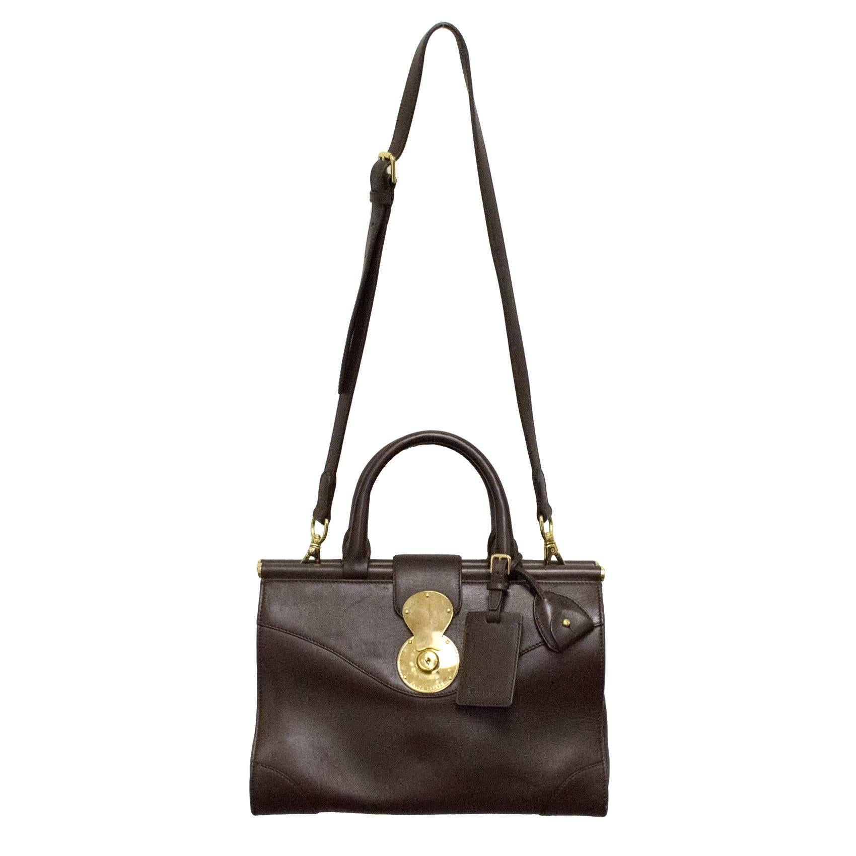 Ralph Lauren brown classic Carlyle Tote made from smooth calfskin with gold finishings and clip fastening. With detachable long shoulder strap, label tag and key pouch. 

Please note there is a small mark on the right side of the bag (please see