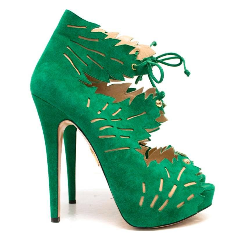 Charlotte Olympia 'Eve' green suede ankle booties from the SS10 'All About Eve' collection featuring a floral laser cut pattern and cut-outs throughout, gold stud detail, peep toe and a stiletto heel. Ties at the ankle. Size 38.

Please kindly
