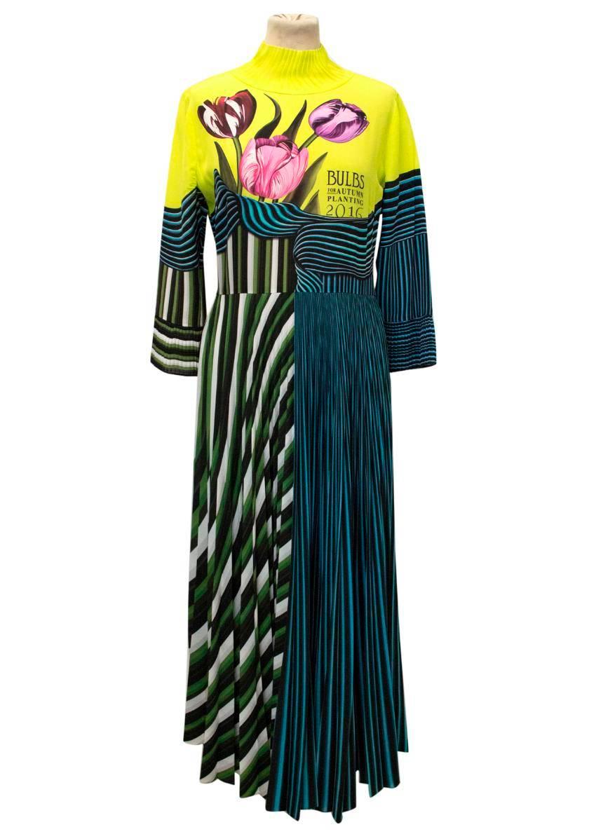 Mary Katrantzou maxi-dress featuring a tulip and geometric print, high neck and 3/4 length sleeves. Fastens at the back with a concealed zipper. The dress is lightweight and fitted at the top with a pleated, flared skirt, flared neckline and flared