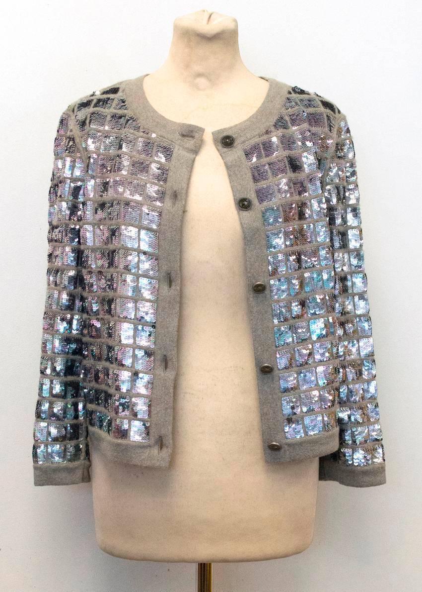 Chanel grey cashmere cardigan with iridescent sequin grid design and handshake detail Chanel buttons.

Made in Italy.
Label FR38 - Mannequin is approximately a UK size 8-10 (US 4-6). Sellers other items vary between sizes S - M (UK 10-12 / US