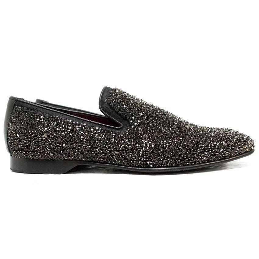 Donald J. Pliner black rhinestone loafers with a red leather insole.

Made in Italy.

Shoes are never worn however, there are some marks to the sole from storage and there are two rhinestones missing from one shoe, which is only noticeable upon