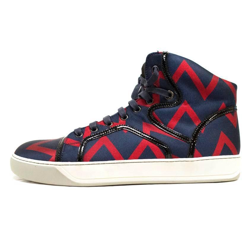 Lanvin high top trainers in navy and red chevron design with brown lining and black patent detail.

Made in Italy.

Item is new and unworn,  some very minor fraying to the tongue of the trainers,from storage, only visible upon close