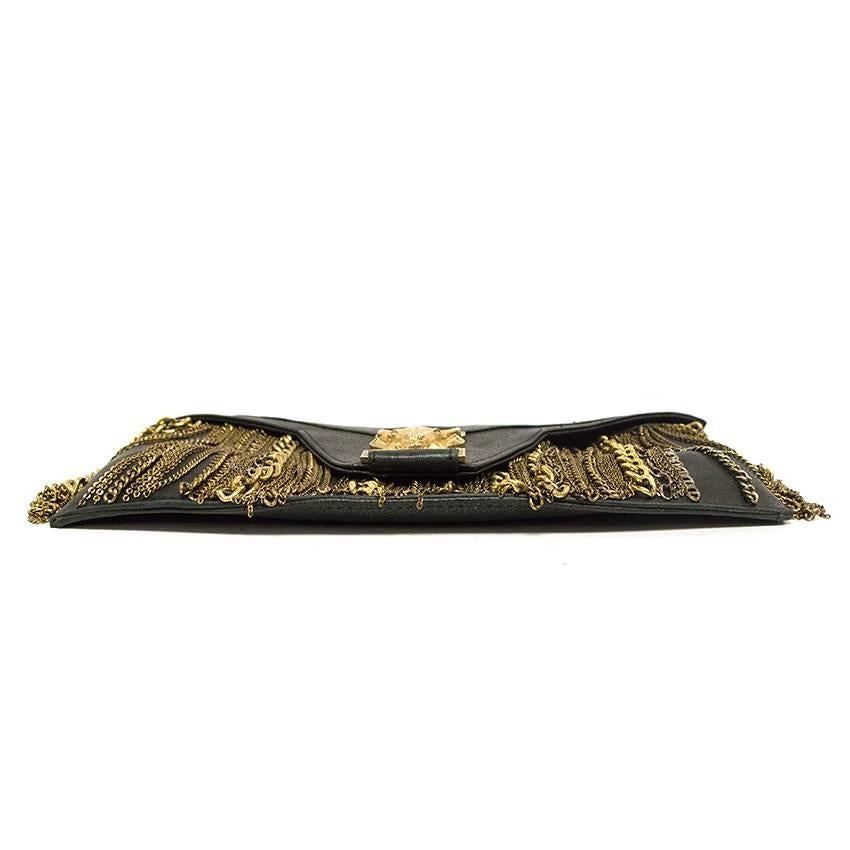 Balmain Black Clutch with Gold Chains.

The item is in good condition. Please note there are slight scuff marks to the leather throughout from gentle use, please see images for reference. 

Condition: 8.5/10

Made in France. 

Approximate