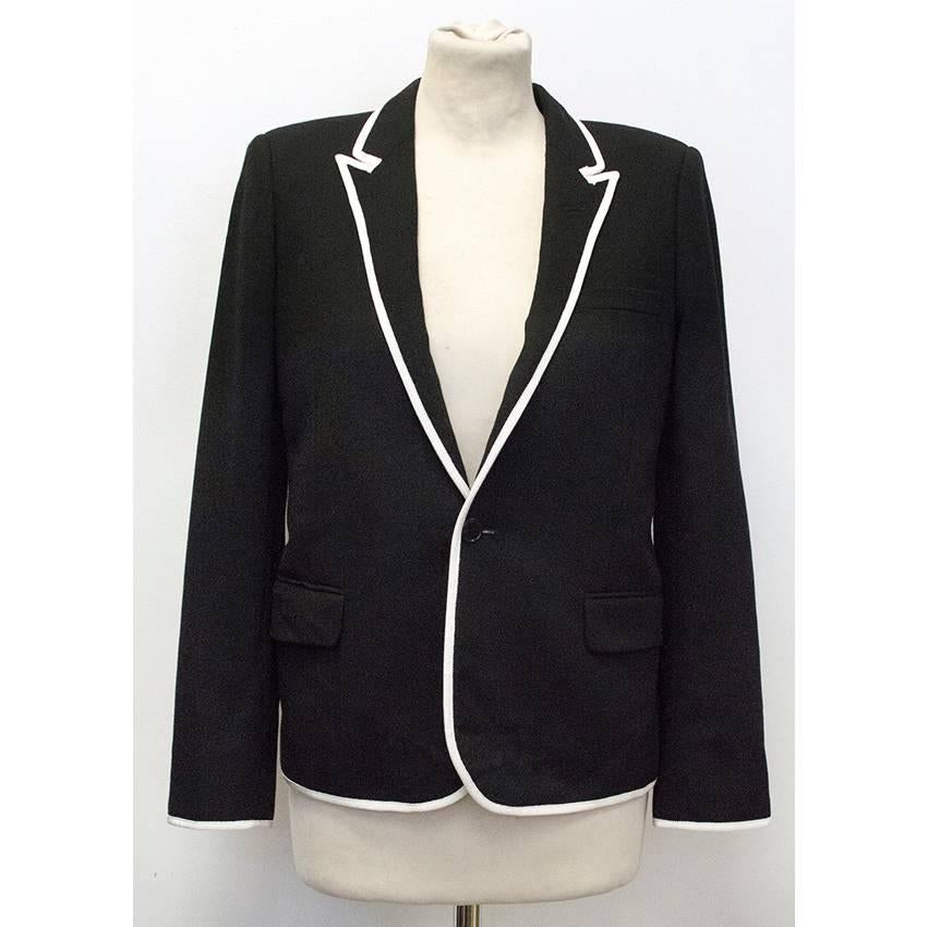 Saint Laurent black and white single breasted blazer with white trimming, and inside pockets. This blazer is the current collection of Saint Laurent Ready To Wear.

This item is in great condition. 

This item belongs to Caroline Stanbury of