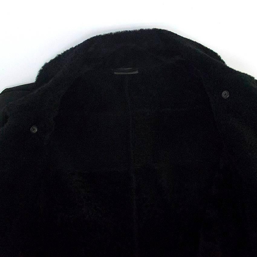 Black leather jacket lined with fur. Silver buckle collar closure. Special leather cleaning only.

New without tags, in excellent condition 10/10. 

Please kindly note, due to the nature of the leather, some extremely faint marks to the back of