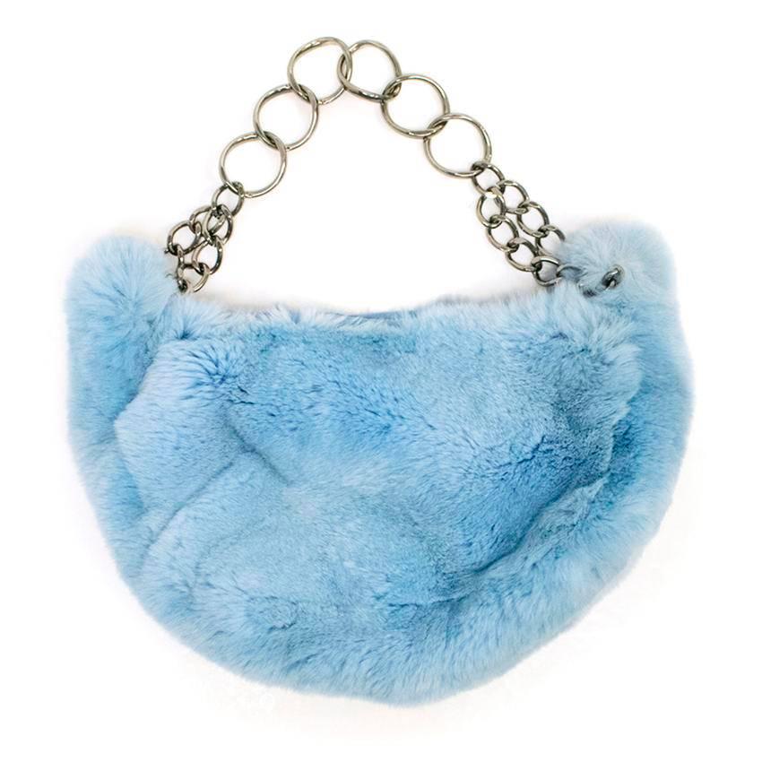 Chanel powder blue rabbit fur half moon shaped shoulder bag. The bag is fully lined and features a chained handle and a Chanel logo charm on the pull of the zip. Comes in a Chanel dust bag.

Made in Italy.

Condition - 9.5/10

Approximate