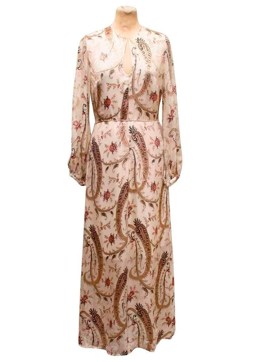 Zimmerman silk maxi dress with gold, pink and black paisley print. The dress features full length bell sleeves, cut out detail on the neckline and an attached string belt.

Size 1

Slight make up mark on the neckline, only noticeable upon very