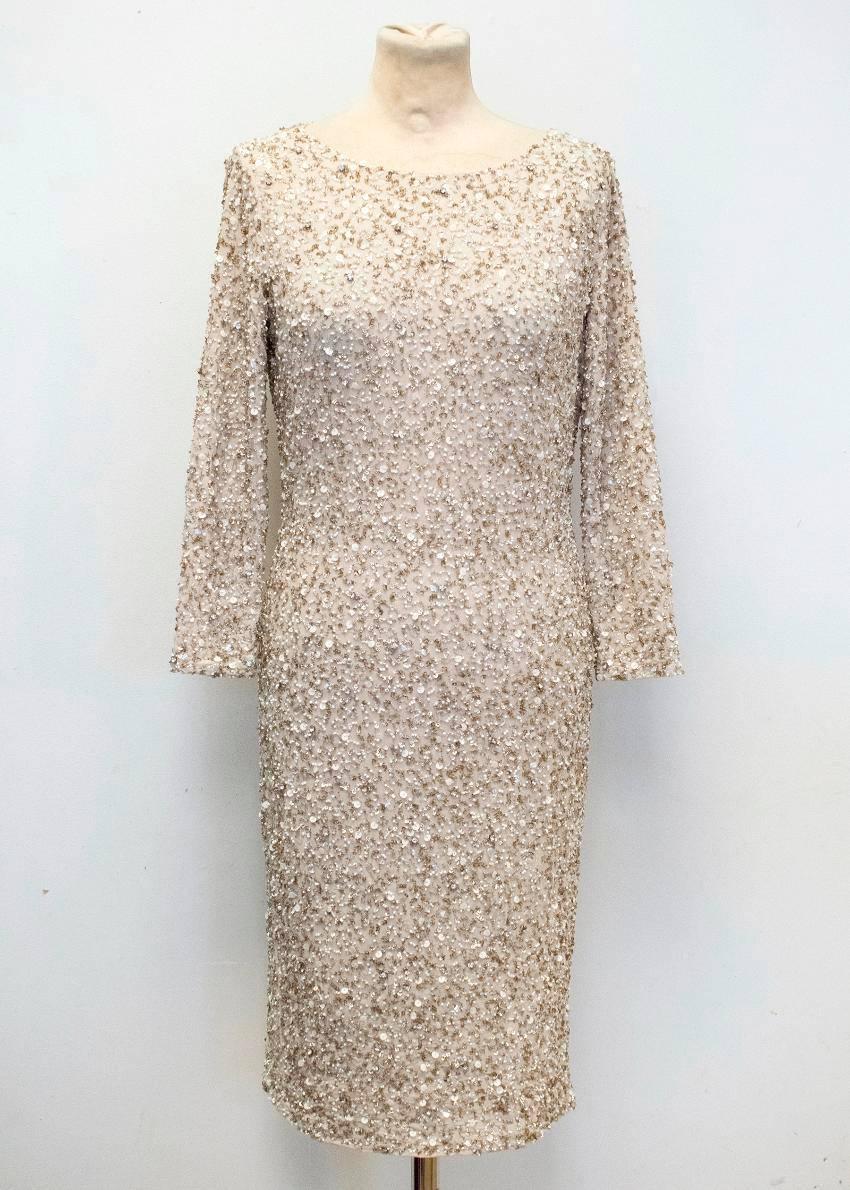 Alice + Olivia cream embellished dress.
- Embellished with beading and sequins 
- Bateau neckline 
- Three quarter sleeves 
- Heavy weight 
- Back silver zipper closure 

Size 6 US

Condition: 9.5/10 despite very minimal wear to the