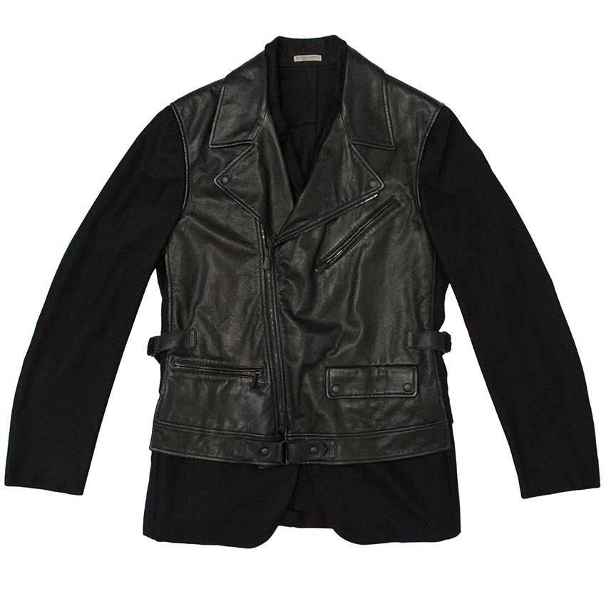Bottega Veneta black cashmere blazer with attached leather vest.
Jacket has double front closure.

Asymmetric zippered front closure for leather vest. Blazer features button down front closure.

Two exposed zipper pockets on the front of the