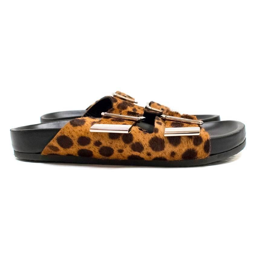 Givenchy leopard print ponyhair double strap sandals featuring silver buckles and black insoles and midsoles. EU 36 / US 6.

Condition: 10/10

Approximate measurements:
Toe to heel: 24cm
Width: 9.5cm
Midsole: 2.5cm